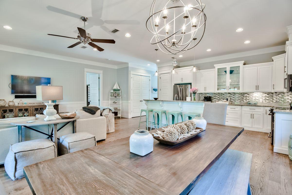 Wouldn't you like to be 'Well Adjusted' in the luxury community of Seacrest Beach? Then let me introduce you to this immaculate beach home, with $88K in rentals booked so far this year. It offers space, privacy and convenience for large families. 3 master suites and the addition of a guest bedroom and large bunk room makes this an excellent choice for different sleeping configurations for multiple families. This Southern charmer, just recently painted, is fitted with matching Kitchen Aid stainless appliances and a floor plan opening up the kitchen and dining areas into the living room that's been appointed with stunning and inviting hues and textures to give the feeling of both warmth and beauty. The gas grilling area, large porches off the living area and 3 bedrooms, a porch swing and private outside shower are just a few of the amenities to be enjoyed outdoors here. Steps away you'll find the largest lagoon style resort pool on 30A and a complimentary tram to take you across the street to the sugar-white sand and shimmering emerald water of the Gulf of Mexico. Seacrest Beach, with it's walking and biking paths, connect to Rosemary Beach and the world-famous Alys Beach. A short golf cart ride or bike ride are all it takes to enjoy all that this area of 30A has to offer.