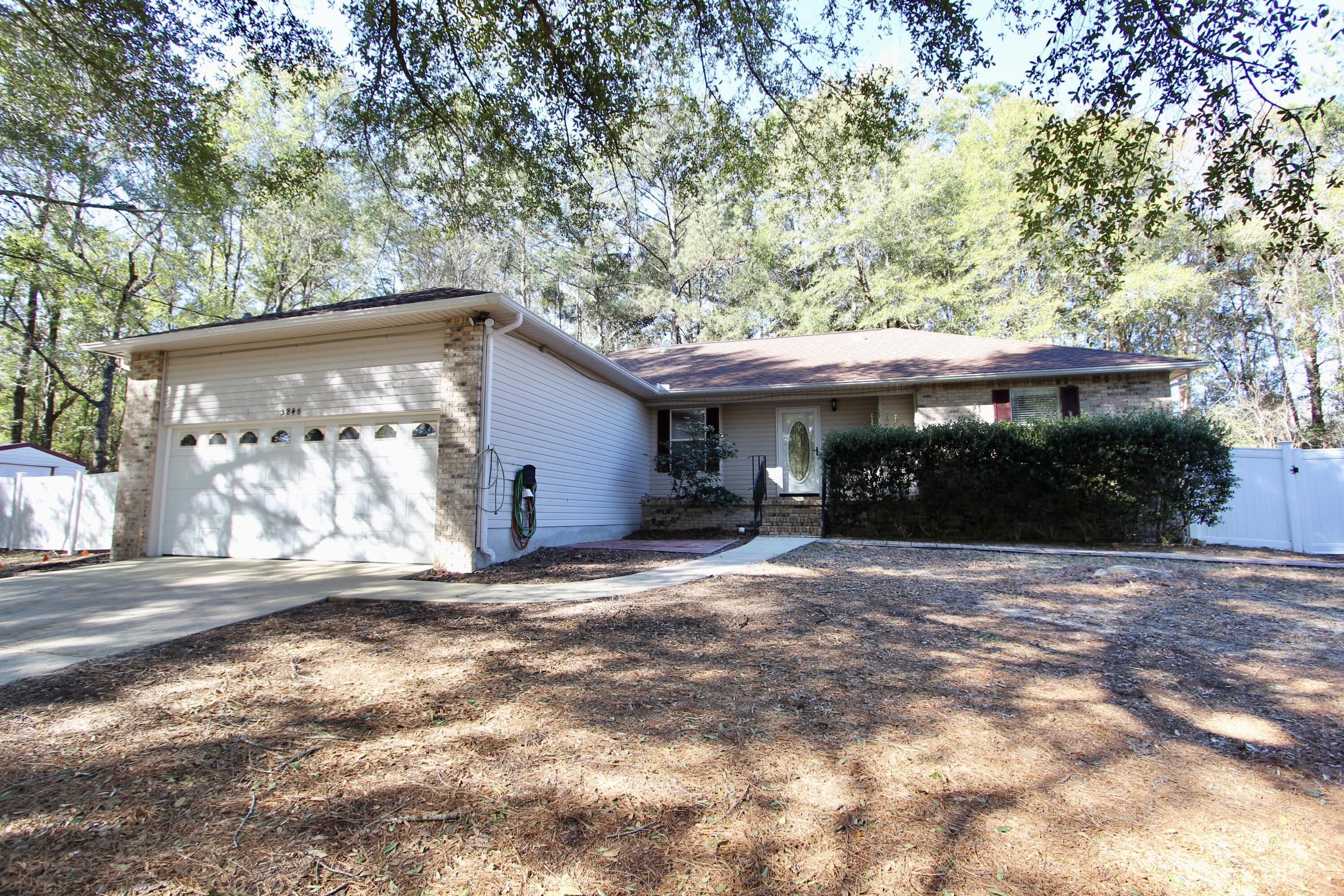 Situated on a peaceful 1-acre lot in Crestview, this well-maintained 3-bedroom, 2-bathroom home offers both comfort and functionality. The partially privacy-fenced backyard includes gated access and an additional smaller fenced area, ideal for pets, gardening, or added privacy.

The property features a freshly mulched and cleared yard, a bonus storage area, and a relaxing hot tub. An air-conditioned shed provides flexible space for a workshop or studio, while an additional utility shed offers ample storage for tools and equipment.

Interior updates include new flooring in the primary bedroom and a brand-new water heater. Major systems have been updated with an AC installed in 2018 and a roof replaced in 2021. The garage is pre-wired for an electric vehicle (EV) charging station. This This property offers a great combination of space, updates, and versatility.