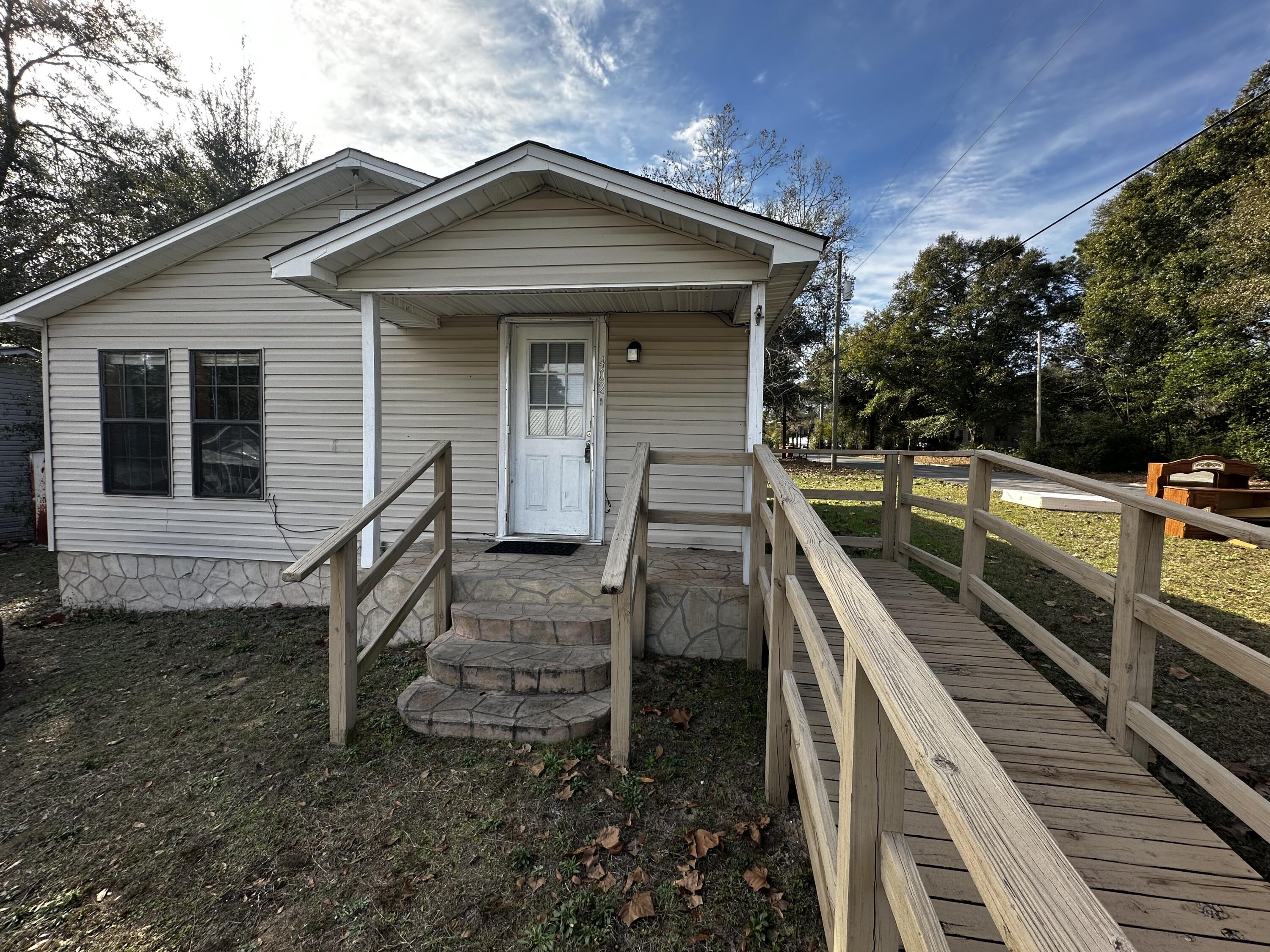 Ownership made easy at 402 Church Street. This charming Florida cottage is perfectly situated on a private corner lot, offering a rare blend of character and modern convenience. It is an ideal find for anyone looking to downsize into a manageable, easy-care space or for an investor seeking a move-in-ready asset in a high-demand area. The location is a standout, placing you right at the heart of Crestview's main corridors. With Highway 85, Highway 90, and I-10 just moments away, commuting to local employers or enjoying a day at the coast is effortless. You are also just minutes from the city's best shopping and dining. This home offers a unique opportunity to own a versatile, centrally located property that is as practical as it is inviting.