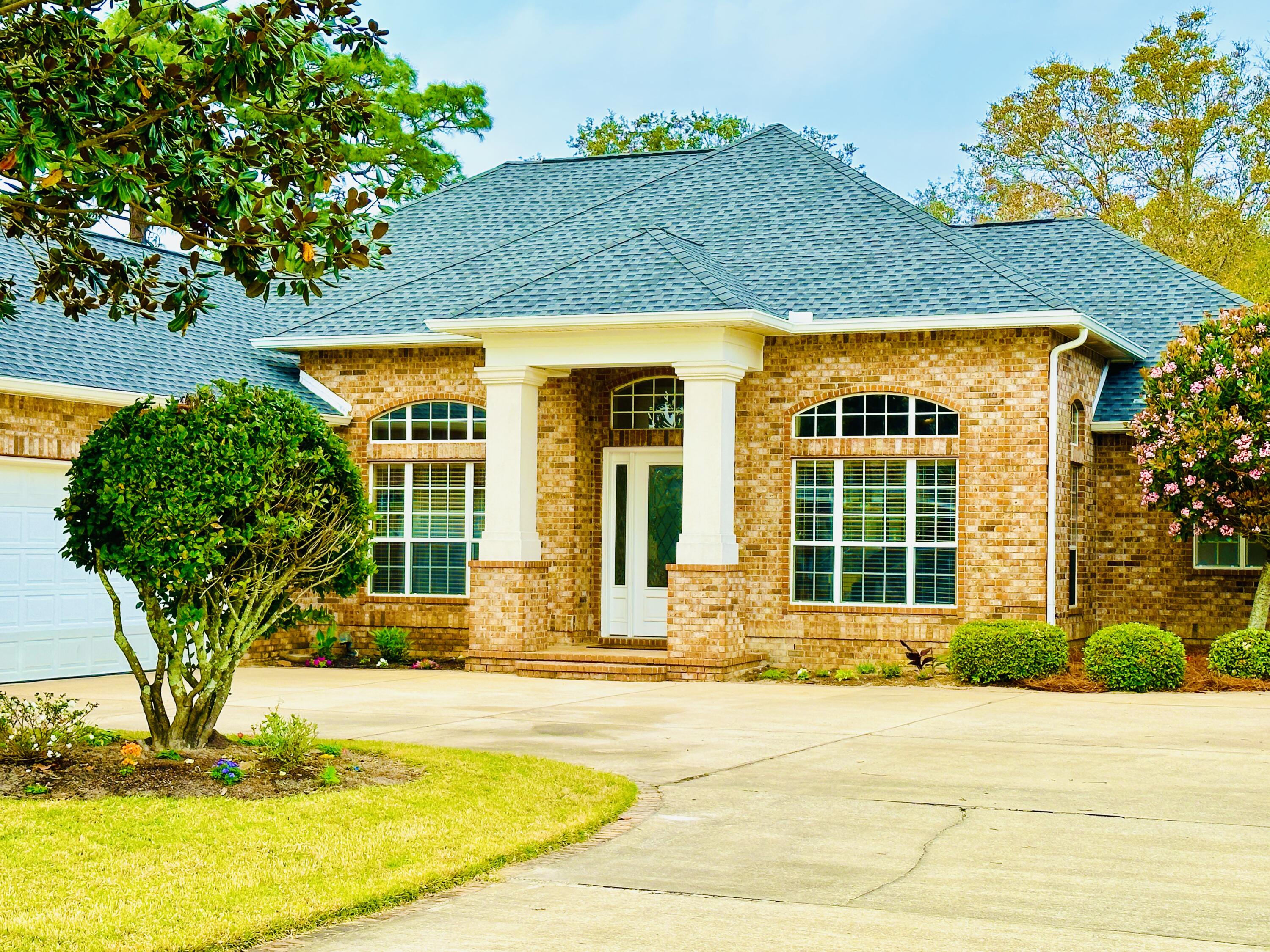 Beautiful 4BD 3BTH home in gated community MAGNOLIA PLANTATION. THREE CAR GARAGE with NEW EPOXY FLOOR installed 2020. NEW ROOF installed 2021. 14 FOOT CEILINGS in entry & dining room. Great room & pool deck has SURROUND SOUND SYSTEM.  Sliding doors to pool deck fold all the way back. SALT WATER POOL & HOT TUB.  Outdoor shower.  Custom kitchen with granite counter tops, stainless appliances, a gas cook top, and custom hood. LARGE MASTER BEDROOM with Hunter Douglas PLANTATION SHUTTERS, sitting area, tray ceiling and TWO walk-in closets.  The Master bath has a KOHLER WHIRLPOOL TUB for two, WALK-IN TILE SHOWER with seat. Whole house central vacuum system.  The former golf course fairway located behind the home may be available to purchase by the home owner in the future.