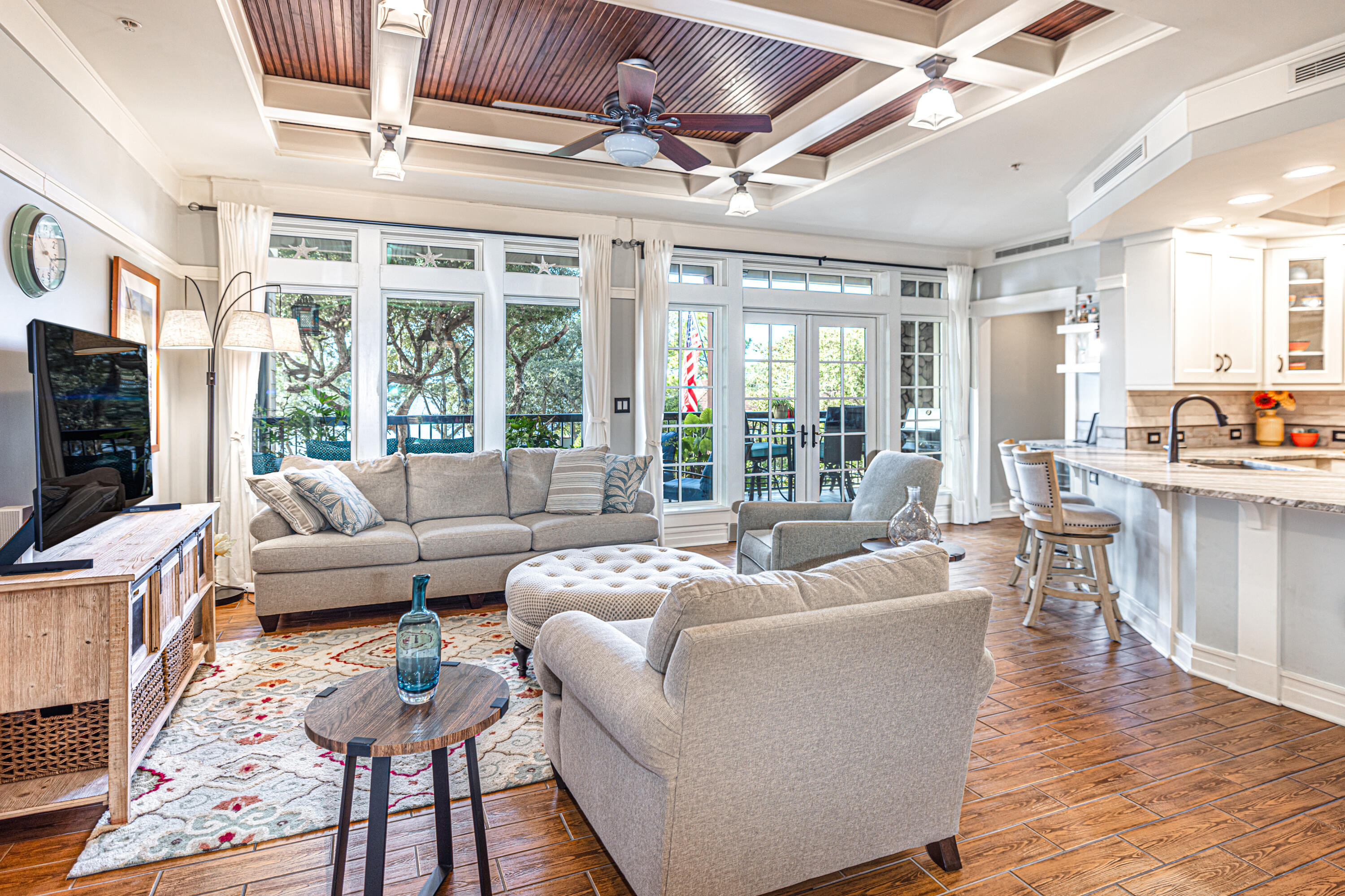 Luxury lakefront and location blend perfectly in this stunning craftsman style condo end unit. Overlooking Lake Powell, Florida's largest coastal dune lake in gated Wild Heron just minutes away from the Gulf of Mexico. There is meticulous attention to detail in every design decision of this spacious three bedroom, three bathroom  condo. Custom features that are handpicked include a stunning center island breakfast bar with leathered texture; stainless appliances; viking gas stove; dry bar with wine refrigerator; beautiful custom cabinetry; a large walk-in pantry with butler's sink and custom shelving; permanent grill; and front-end washer and dryer.  The large dining room and spacious living room are perfect for entertaining. In addition, the tile throughout shows like hardwood with tongue and groove coffered ceilings in the main living area.
It is easy to lose yourself with the lake views as your make your way to the primary bedroom suite with southwestern views. The primary bedroom suite is a retreat with French doors that open up to a private balcony overlooking Lake Powell. The primary bathroom suite offers double vanities, a luxurious jetted tub, a steam room and shower combo, ample custom cabinetry and a large walk-in closet. There are two guest bedrooms with two additional baths that offer plenty of room and privacy in a split plan. 
Lakeside Lodge condos are hidden gems located within Wild Heron, which is a gated community, surrounded by the Sharks Tooth gold course, a Greg Norman designed masterpiece. There are two other golf courses including Watersound, and a new 18 hole golf course with Watersound memberships available offering additional amenities. Parking is conveniently located underneath the building for easy access and the condo is on the first floor, so you only have to go up one flight of stairs to get to the condo. 
Wild Heron has world-class amenities which including: 24 hour security and gated access, walking trails to Watersound Origins, two pools, hot tubs, fitness center, boathouse with canoes and kayaks for residents to use, a covered picnic area with fireplace, and a fire pit with seating. This complex offers it's own private pool and library.
You are a short drive to the Gulf of Mexico, Pier Park, Lake Powell Park, 30Avenue for shopping  and entertainment, Camp Helen State Park, and Rosemary or Alys Beach.