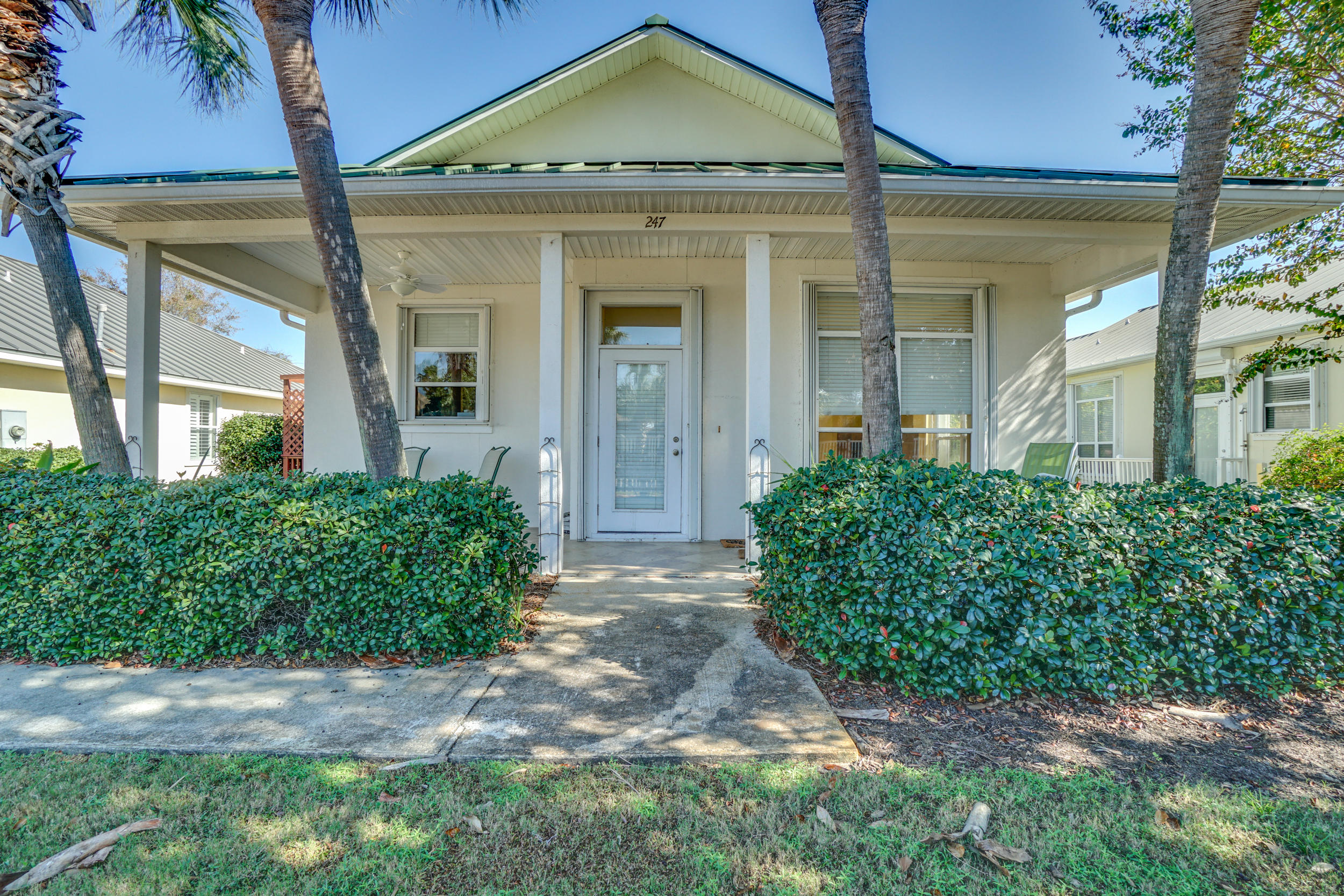 Incredible Caribbean-style beach cottage, walking distance to the beach with 500 feet of private, deeded beach access. Maravilla is a gated community offering resort style amenities including 2 swimming pools, tennis courts, workout facility, and more. This spacious house has a terrific floor plan highlighted with an open kitchen and dining/living room area, with 3 BD, 2 BA this house has plenty of room to be a primary residence, a second home, or an investment property. The master bedroom features an en suite bathroom that includes a walk-in rain shower and double sink, with the two guest bedrooms sharing a common bath with tub/shower. The floor throughout this home is upgraded, brand new hard-woods. The HVAC unit  is only 1-year old. Enjoy the cozy, covered front porch surrounded by lush landscaping and Florida palms. All lawn, shrub, and irrigation is serviced by the Homeowner's Association. Maravilla is perfectly located near the best shopping, dining, restaurants and entertainment that Emerald Coast is famous for.