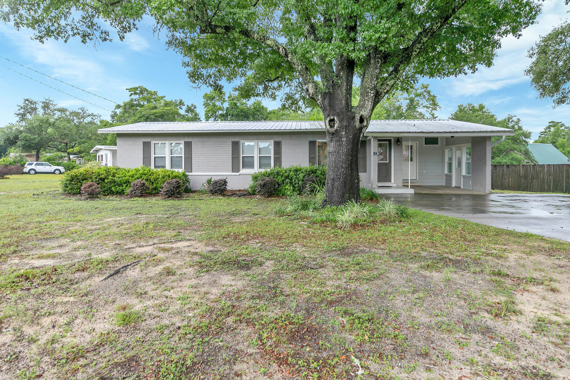 Come see this beautiful, updated home in Niceville! Situated on a large corner lot in a quiet neighborhood, this house has been fully renovated within the past 4-6 years.  Over 100k renovation, high end/quality work and no expense was spared.  New hardwood flooring, new kitchen, new bathrooms, new roof, new HVAC, new windows, new doors, all new high end kitchen and bathroom appliances and washer/dryer, new plumbing, new electric junction box and recessed lighting throughout, new ceilings and drywall, hardware, interior and exterior trim and detail work, and much more.  There is a covered carport and oversized driveway that was re-done in the past few years, in addition to new landscaping.  The home is located near Niceville High School and Ruckel Middle School (consistently recognized as one of the best schools in Florida). There's plenty of space to add a pool or whatever else to make this your dream home. The home is on city water but there is also a well on the property and a storage shed in the backyard.