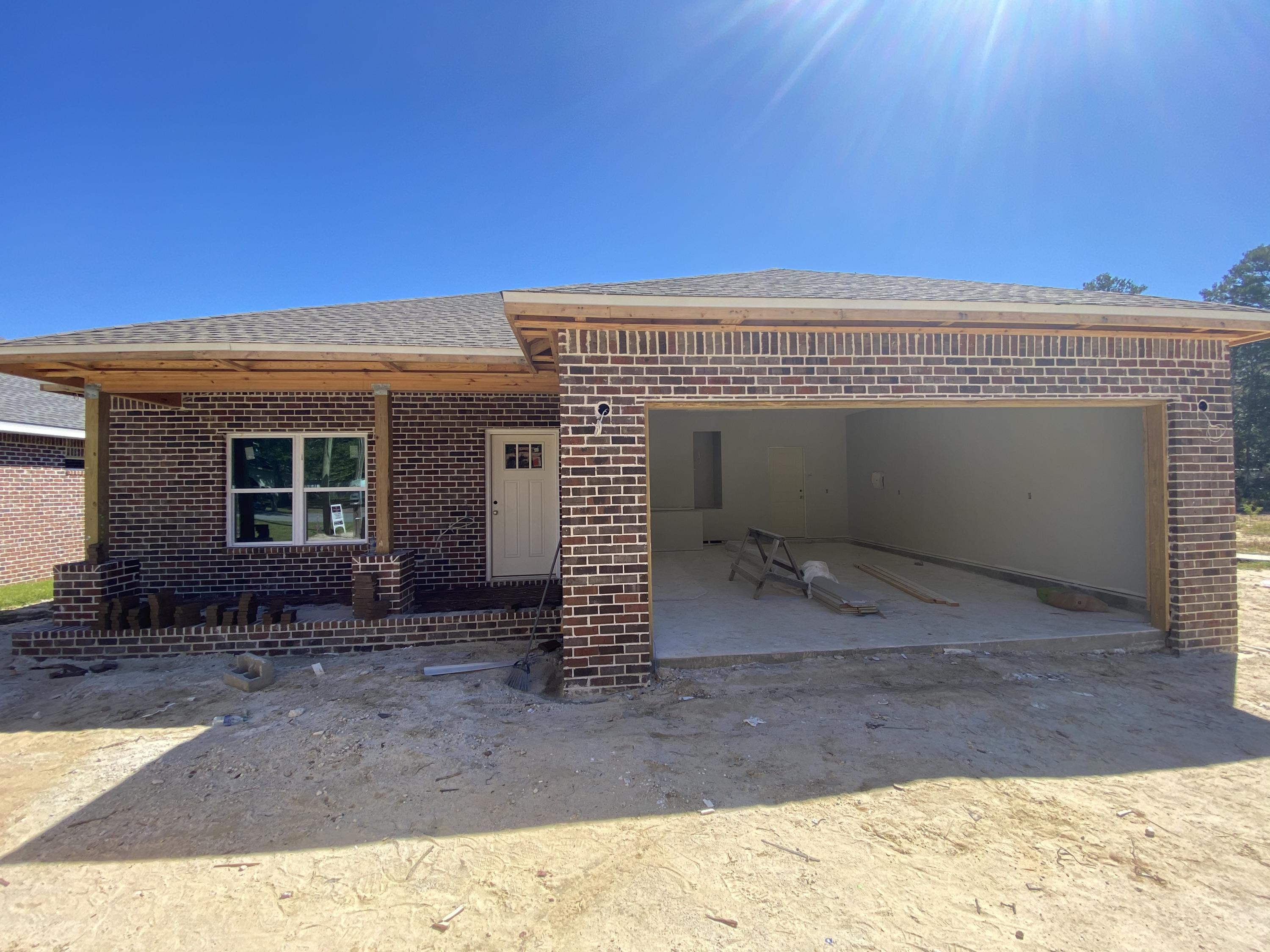 ***As of 8/10, framing has begun!*** 
New construction in the heart of Niceville! This BRAND NEW home features 3 spacious bedrooms and 2 full baths. The master suite boasts a separate tub and tiled shower, double vanities, walk in closet, coffered ceiling and LED recessed lights. This plan is open concept. Coffered ceilings are featured in the living room as well. The home will be all brick with Impact windows for hurricane safety. The exterior will have a sprinkler system, fully fenced yard and a screened patio with deck. The kitchen is a stunner with its granite countertops, high end cabinetry, stainless appliances and custom wood shelving in the pantry. This home will be move in ready when complete!