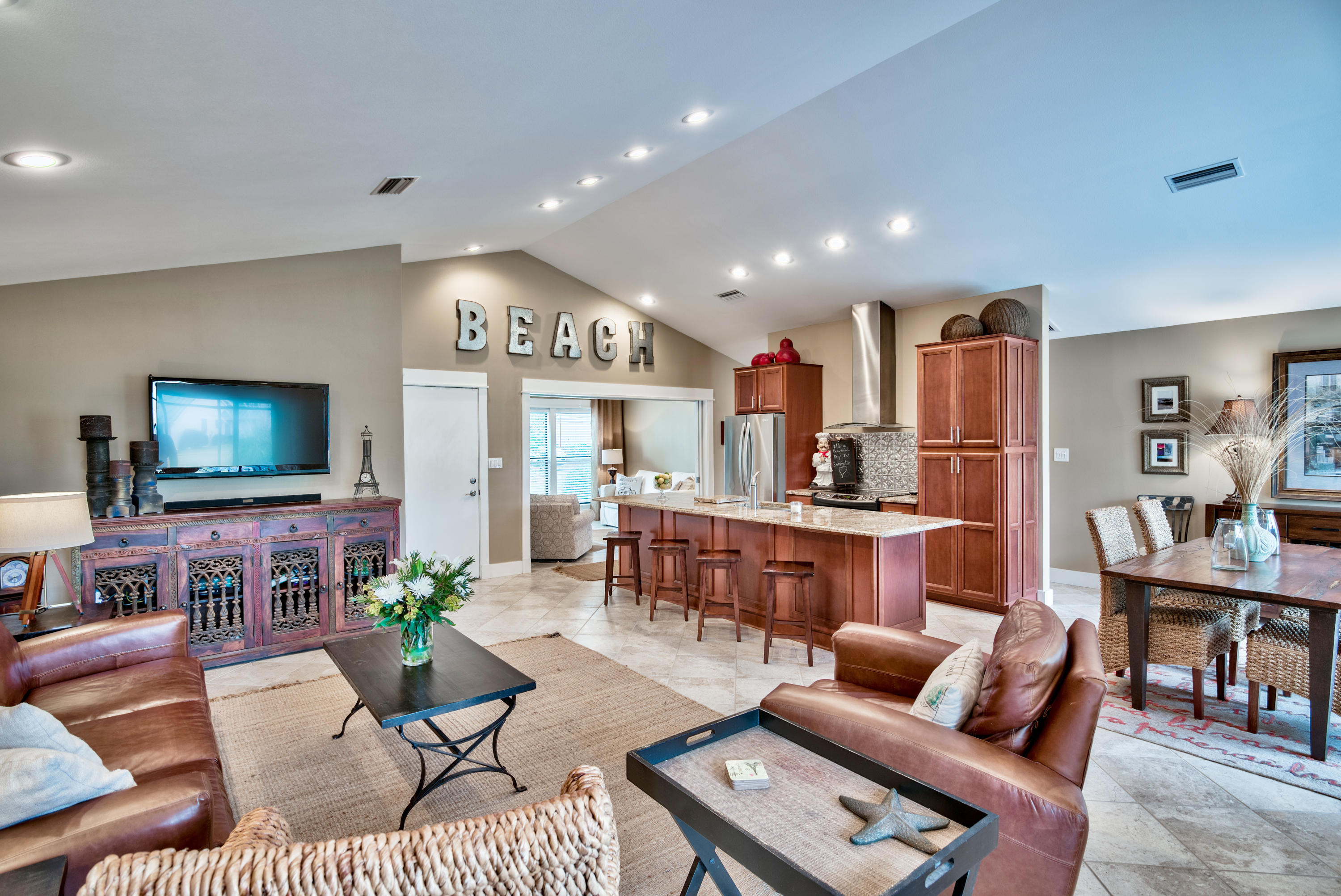 EXQUISITE REMODEL in lovely Augusta Village. With its soaring ceilings and subtle monochromatic tones, it is straight out of HGTV! SEE IT TO BELIEVE IT! The OPEN FLOORPLAN, 12' cathedral ceiling, split bedrooms, huge kitchen island, granite, stainless, large den, screened porch & a carport combine to make it one of the most exceptional offerings in Sandestin AND at a great price. Enjoy carefree living with a condo assoc. in your free standing house. Sold furnished. This beautifully designed & decorated home is a perfect second home or vacation rental. The DEN addition allows to be used as a 3 bdrm unit. Large back patio and your private oversized carport complete the setting. Your association takes care of all exterior maintenance so you can enjoy your new lifestyle.