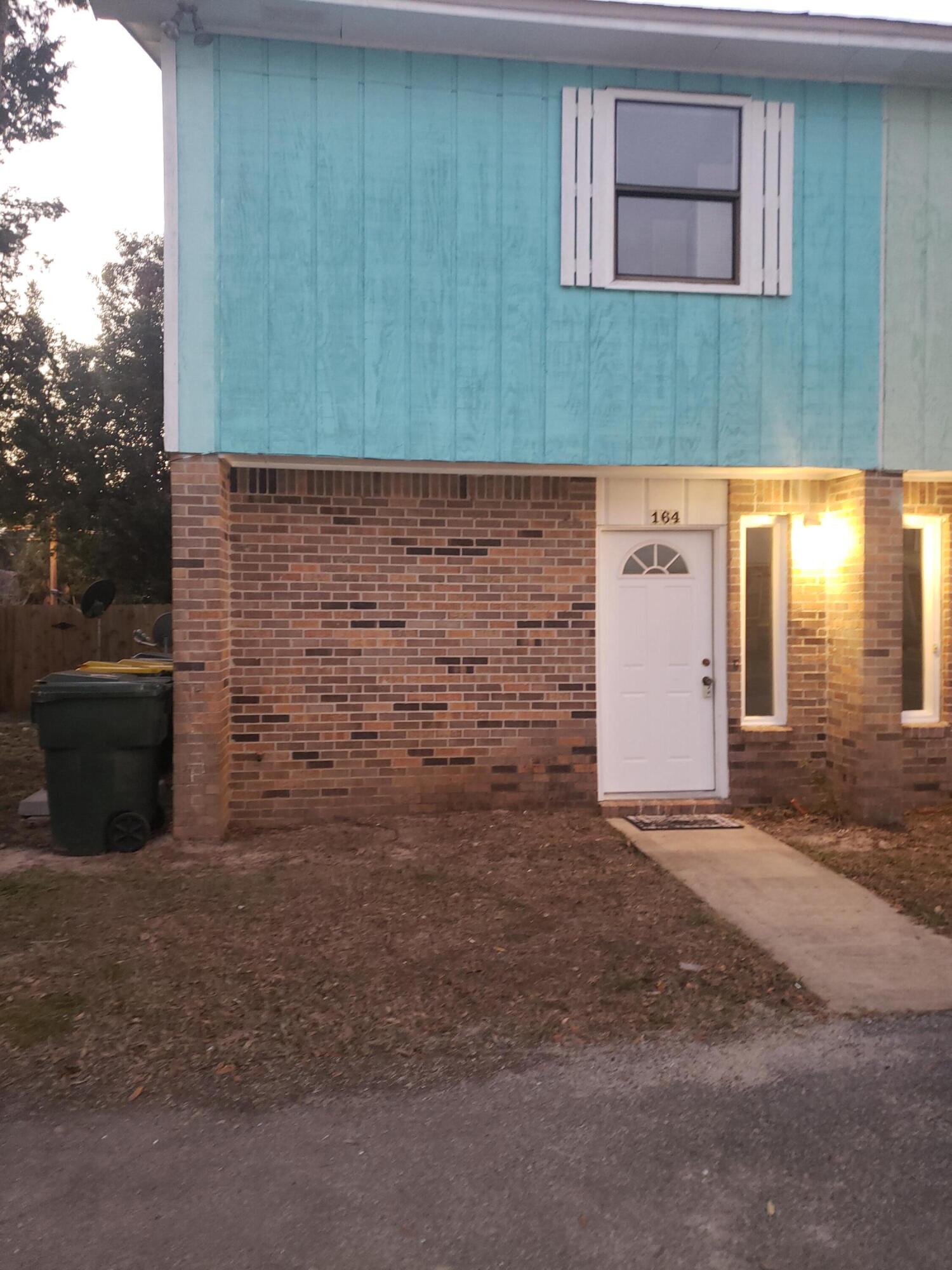 This home is centrally located to ALL the amenities that the beautiful Coastal City of Fort Walton Beach has to offer including walking distance to Okaloosa Island, Library, Convention Center, shopping and dining, etc. Fort Walton Beach is growing exponentially. You will never run out of things to do on the Beautiful Emerald Coast! Conveniently located between both Hurlburt and Eglin Air Force Bases! The backyard has a gate that allows access from the street and there is additional storage off the patio. The 2 bedrooms are located upstairs along with the full bath with separate shower.  Master Bedroom has double French doors that open up to a balcony that overlooks the fenced back yard. New Roof 2021. Call for your showing today! Awesome investment or first-time.