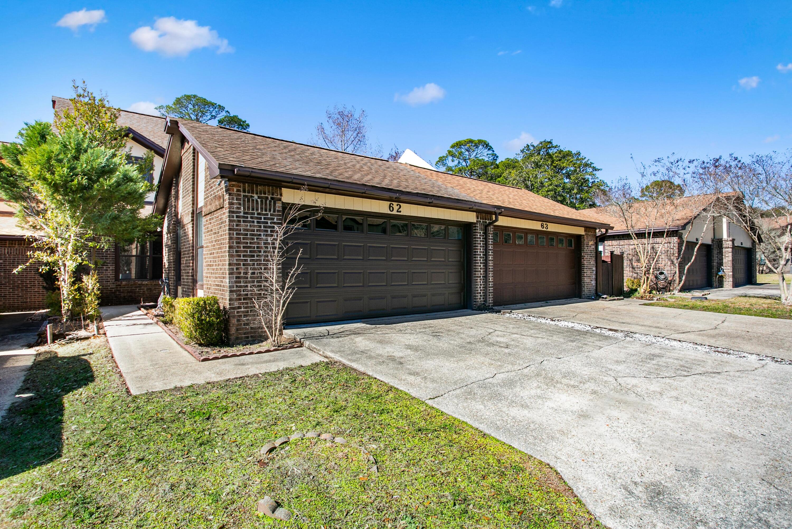 NEW ROOF just installed on this 3-bedroom, 2-bath townhome that's ideally positioned across the street from the community dock on the bayou, providing easy access to the peaceful water views. Located in a well-established community, Hidden Cove residents enjoy a variety of amenities including a pool, clubhouse, workout space, and boat dock. You'll be conveniently situated near Eglin AFB, Hurlburt Field, Duke Field, and 7th SFG - Approximately 2 miles to Eglin's East Gate, offering excellent accessibility for daily commuting. Vaulted ceilings in the living room and a wood-burning fireplace are the perfect backdrop for the spacious living area. There's also a versatile alcove under the stairs, offering flexible space that's ideal for a home office or reading nook. The main bedroom is on the first floor with a walk-in-closet and an ensuite that includes a separate shower and jetted tub. Upstairs are two spacious bedrooms (one with a peek-a-boo water view) and a bathroom that adds character with a classic pedestal sink and a claw-foot tub! Head out back -through one of the two sliding glass doors- to a new deck that overlooks a grassy space. With its thoughtful layout, bayou proximity, and community amenities, this townhome offers a balance of comfort, convenience, and lifestyle.
