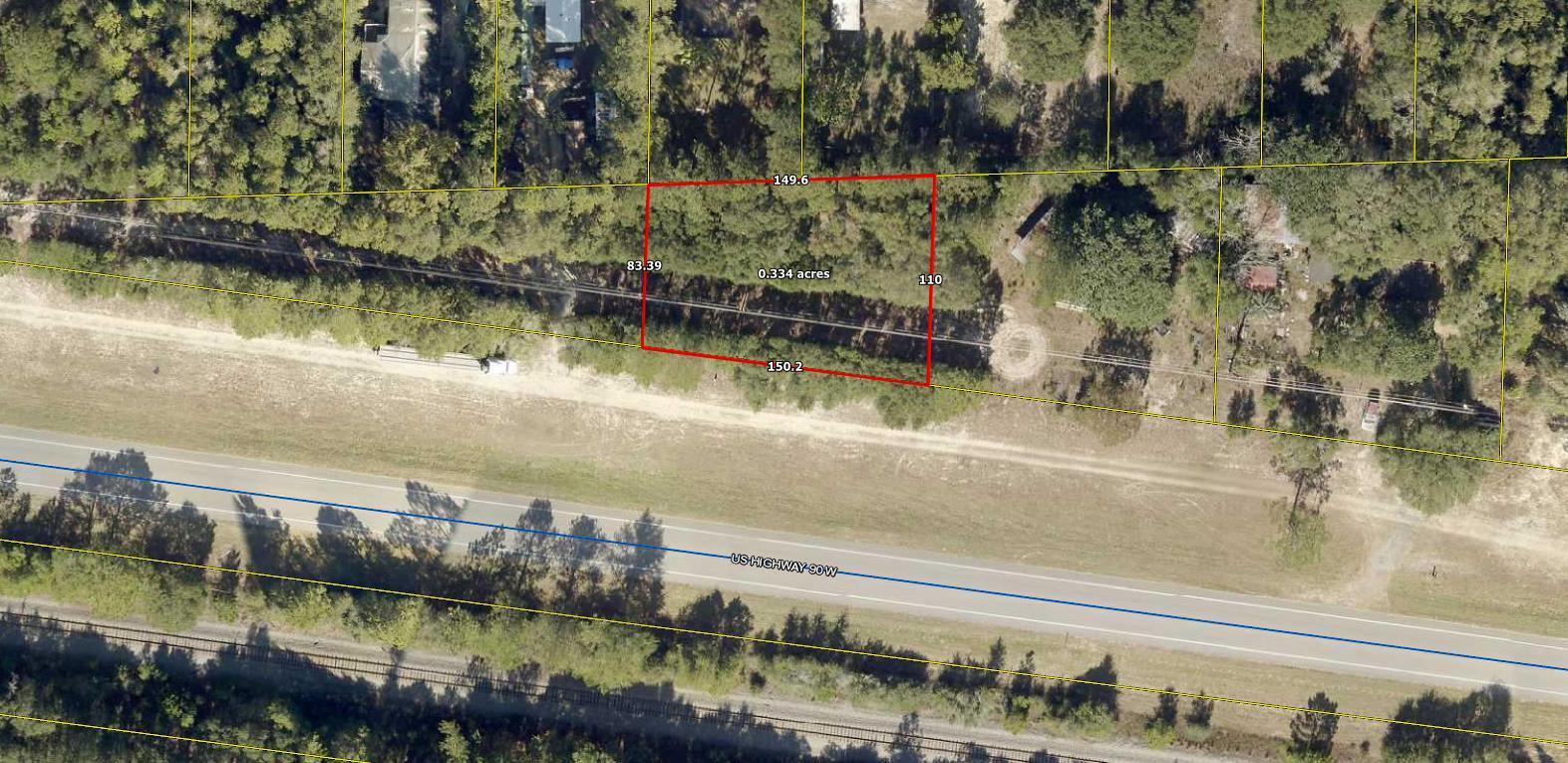 1/3 acre lot on Hwy 90 W.  Lightly wooded lot on paved Hwy in growing Mossy Head.  Apx. 150 ft. on Hwy 90. Power available at the road, public water available through Mossy Head Water Works (tap fee would need to be paid), septic tank would be required.