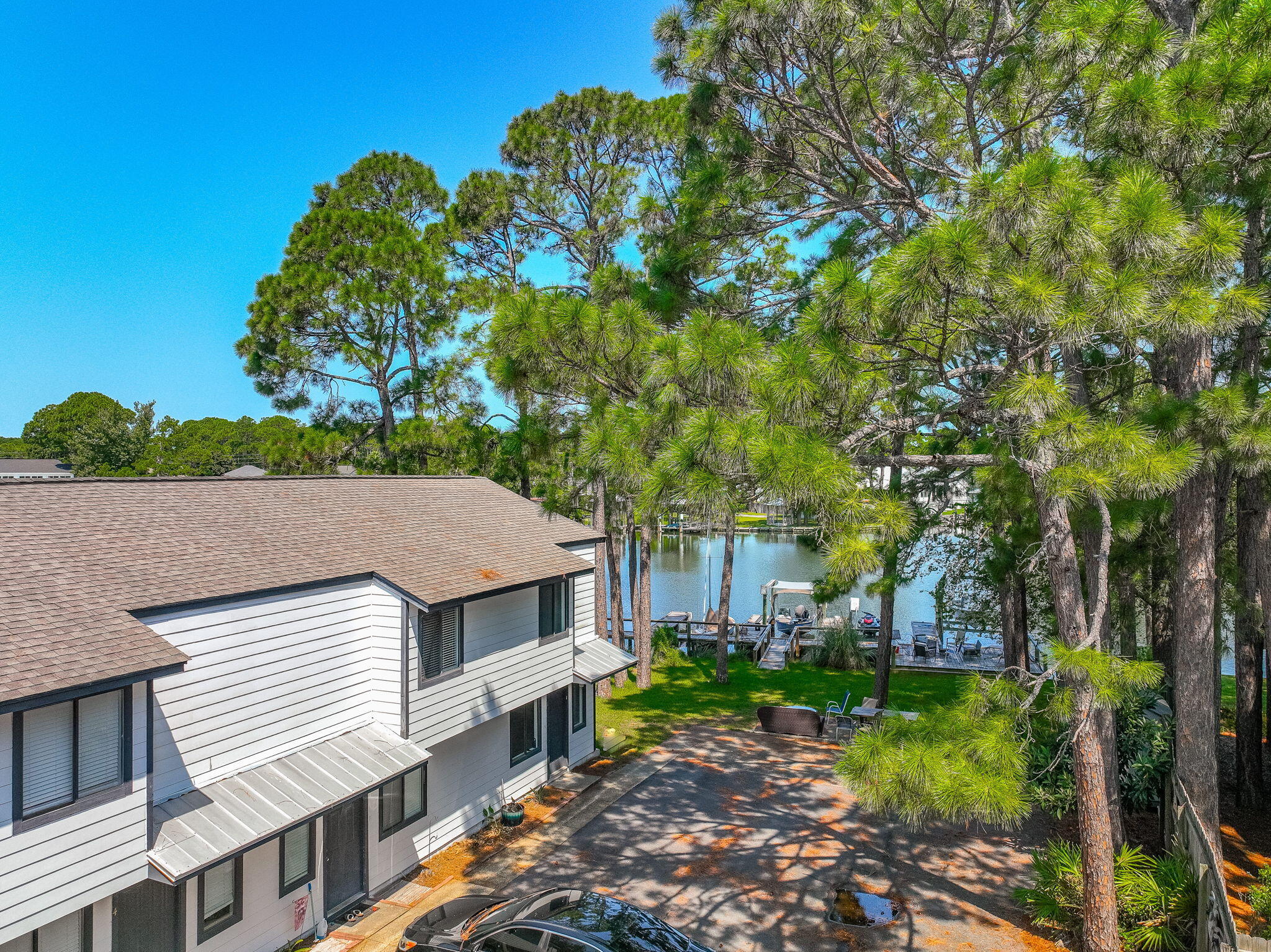 Renovated Buck Bayou water front unit with boat dock that hasn't been on the market in over 30 years! Located in a Waterfront four-plex with shared dock on Buck Bayou that leads directly to the bay! Unit has a deep water and deeded boat slip. Boat slip will hold appx. 24 foot boat with the draft being 4 to 5 feet. Development has 98 feet directly on Buck Bayou. Renovated 2 bedroom 1 1/2 bath with new paint, LVP flooring, updated kitchen with new appliances. Renovated bathrooms and with a large deck looking out on the Bayou. Located in the popular and fast growing area of Mack Bayou and with close proximity to Sandestin. Perfect for a 2nd home or a week-end getaway.   Property has rented for $2500 a month and boat slip has rented for $300 a month.