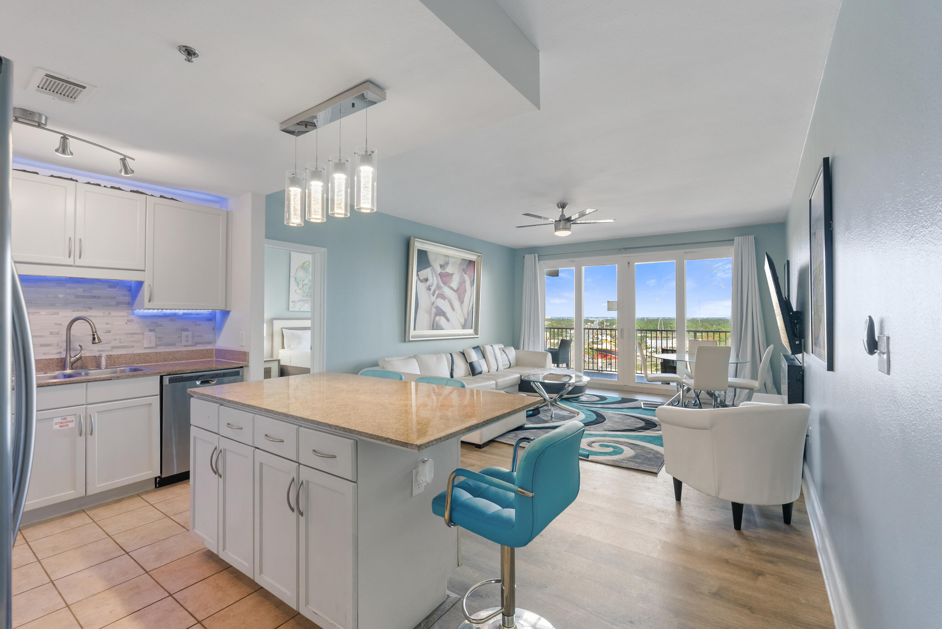 Fully renovated turn-key 3BR/2 BA condo in the beautiful Laketown Wharf Beach Resort.  This 1262 sqft unit offers spectacular city/lake views from the 15th floor!  This unit has been continuously profitable: 2021/$61,569, 2022/$50,499, 2023/$52,499, 2024/$49,858 and 2025/$55,656.

Can be used as primary residence, short term rental or investment property AND this unit is being sold FULLY furnished - with no exclusions!  Everything you see in the photos and viewing is being sold with the property.  All furniture/linens/tv's/appliances/etc - turn-key and income producing!  

Step into the coastal ambience of this beautifully themed condo with touches of rich blues, whites, and creams.  Your kitchen gives ample space to cook up that  delicious meal as you return home from the emerald coast water and white sugary sands of the PCB coast, all just a few minutes walk, with convenient access for Laketown Wharf guests.  Your kitchen features white cabinets, granite countertops and LED lighting throughout.  Nestled close by you can relax on your large oversized couch, next to your electric fireplace with a large TV above.  Step onto your private patio, overlooking Panama City Beach with gorgeous city and lake views below.  Be mesmerized each night by the fountain and light show dancing on the lake waters below, right next to the boardwalk, where restaurants and shopping line.  Soak up the rays during the day, all enjoyed in the privacy of your own balcony deck with views most dream of.

Escape to your master suite with adjoining master bath and soak your cares away in your large master soaking tub.  Master bath also includes dual vanities and shower.  Step out your doors of your master suite right onto your private balcony. The extended balcony can be accessed from the living room and the master suite! 

There are two additional bedrooms with a shared bathroom, also with a shower and tub combo.

This unit sleeps 6 comfortably but can accommodate up to 10 people so it's perfect for large families and entertaining.

Laketown Wharf Resort is in the heart of all the fun & excitement of Panama City Beach.  Just steps away from the world's most beautiful white-sand beaches, shopping, dining and entertainment.  Amenities include: convenient beach access, 5 unique pools, a kids funscape playground, Splash Bar & Grill, Gulf View Fitness Center & covered garage parking. Laketown Wharf Offers A Variety Of views Including The Gulf Of Mexico, Lake & Golf Course. Enjoy the nightly fountain & light show & market shops along the 52,000 sqft Of Lakefront Boardwalk.