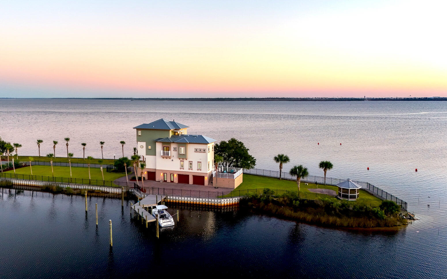 Welcome to 34 Palms — A One-of-a-kind Waterfront Oasis Redefining Luxury Coastal Living. Experience the pinnacle of Florida waterfront living at 6701 Yacht Club Drive, a remarkable 0.83-acre peninsula estate with 360° panoramic bay views and endless adventure come together. Perfectly positioned with water on all sides, this 4-bedroom, 5-bath, 4,125-square-foot home captures the essence of the Florida boating lifestyle — where every sunrise, sunset, and gentle breeze reminds you that you've arrived somewhere truly special. A Boater's Paradise: With direct Gulf access from your backyard, 34 Palms is your personal gateway to the open water. Offering both a private dock and an additional community boat slip, this property was designed for those who love to live life on the water. The calm bay setting is also perfect for kayaking, paddle-boarding, and jet skiing, all from the comfort of your home. 

Outdoor Living at Its Finest:
Every inch of the estate was designed to celebrate outdoor living. Expansive decks and palm-lined walkways lead to multiple lounging areas ideal for entertaining or simply soaking in the serenity. Surrounded by lush tropical landscaping, this private oasis allows you to fish, paddle, or relax in complete tranquility  all while enjoying breathtaking 360° views unique to its peninsula setting.

Elegant Interiors & Inspired Design:
Inside, natural light pours through floor-to-ceiling windows, illuminating open living spaces that seamlessly blend indoor and outdoor living. The heart of the home  a bright, modern kitchen and inviting living area  is perfect for both gatherings and quiet reflection, offering stunning water views from every angle.

Luxurious Private Retreats:
The primary master suite, perched on the top floor, provides a peaceful sanctuary with a private balcony, outdoor shower, and sweeping sunrise-to-sunset views. A third-floor guest suite offers its own ensuite bath and walk-in closet, while two additional bedrooms share a charming Jack-and-Jill bath ideal for family or guests. A three-car garage with an office or workshop space completes the thoughtful layout.


Key Features

-0.83-acre peninsula lot with water on all sides

-Over 500+ of Waterfront

-Private dock plus community marina boat slip

-Direct Gulf of Mexico access for boating and fishing

-Expansive 4,125 sq. ft. of light-filled living space

-Multiple decks and outdoor entertaining areas

-Lush tropical landscaping 

-Waterfront Gazebo with Private Beach 

-Largest lot in East Bay Preserve

More than a home, 34 Palms is a lifestyle  one defined by endless horizons, outdoor adventure, and effortless elegance. Discover unparalleled waterfront living where every day feels like a getaway.

Schedule your private tour today and experience how 34 Palms redefines luxury coastal living.