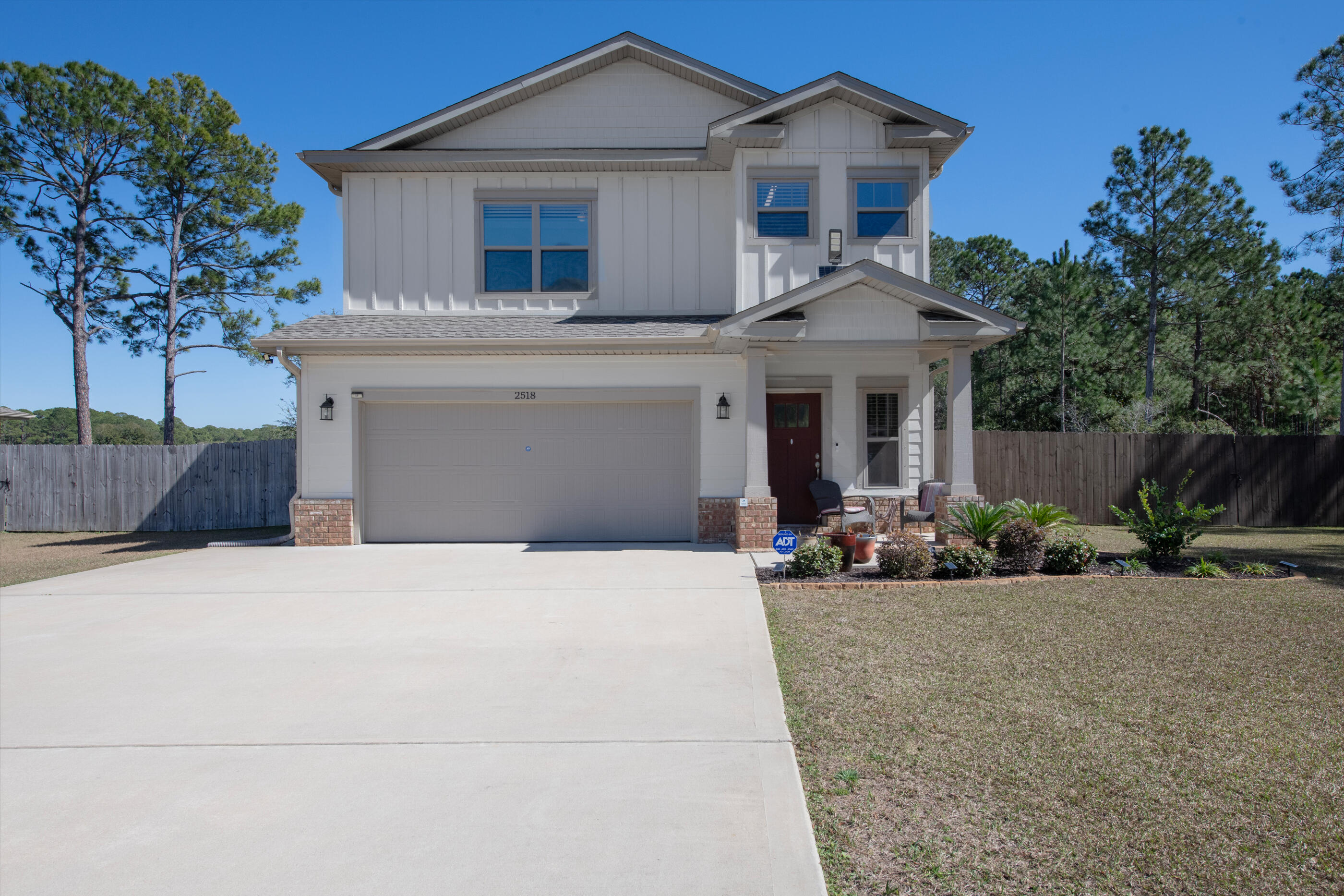 Tucked away on a peaceful .27-acre cul-de-sac lot, this meticulously maintained 3 BR, 2.5 BA home offers 1,931sf of ''why yes, this does feel like new construction'' living, because at just 3.5 years old, it practically is! Step inside & enjoy a bright, welcoming main level where the living room, dining area, & kitchen flow effortlessly together, perfect for everyday living & easy entertaining. The kitchen shines with granite countertops, soft-close cabinets & drawers (no slamming here!), & stylish finishes that pair beautifully with durable LVP flooring that runs throughout the entire home. Architectural touches like transom doorways & crown moulding add charm & character, giving the space that polished, custom feel. Upstairs, you'll find all three bedrooms & the laundry room thoughtfully located on the second level; keeping laundry day convenient & your main floor clutter-free. Out back, the screened-in patio offers the perfect spot for morning coffee or evening unwinding, all while overlooking a peaceful pastureno rear neighbors peeking over the fence here! Practical perks? You've got them. A whole-house water softener is already installed, & the garage features a 200V plug ready for your electric vehicle charging needs. And when it's time to explore, you're less than 8 miles from the sugar-white sands of Navarre Beach and Florida's longest fishing pier; plus just minutes from shopping & restaurants. Nearly new, thoughtfully upgraded, & perfectly located, this home is ready to make your next chapter easy, comfortable, & just a little bit coastal.