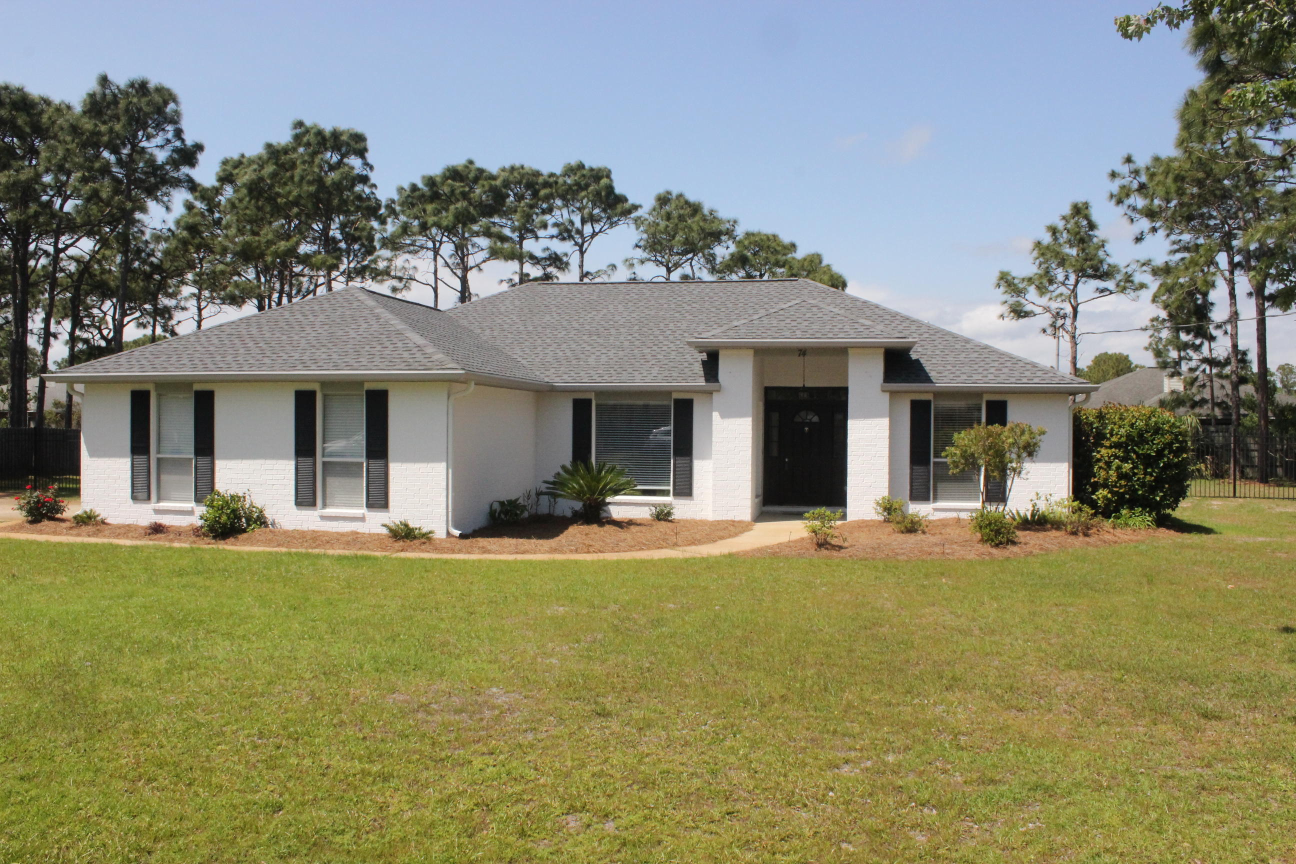 There aren't many lots this size south of 98 and it's on a Cul de Sac. This is a lovely all brick home that has been well kept. The home features a very open floorplan with vaulted ceilings in living area, tile throughout and has crown molding in master bedroom. Kitchen has granite counters and stainless steel appliances. off the back is a huge covered screened porch. This home is move in ready. The lot has plenty of room for a pool. The roof was replaced in 2017
