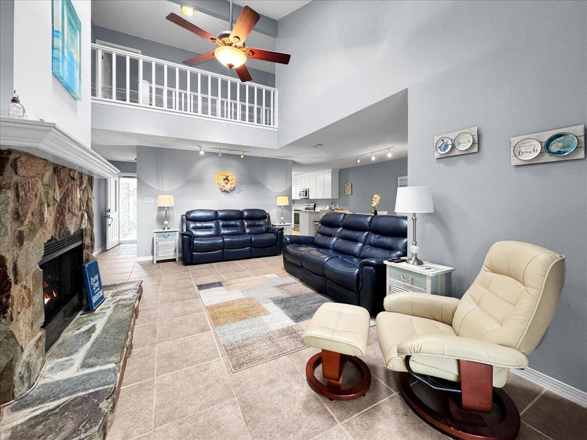 Step into this extraordinary opportunity nestled in the heart of Navarre, where charm and convenience converge seamlessly. This meticulously, maintained home presents a rare gem in a sought-after soundside neighborhood. Just minutes from the bridge, and across from Publix and dining options, this location offers the epitome of coastal living. This home boasts sound views from its large master balcony and has an open floorplan with its two-story den and catwalk.  Natural light dances throughout the spacious sunroom, accentuating every detail of the home's impeccable design. Open the door to the peaceful outdoor space with a covered patio and more views of the water. But wait there is more! This home also comes with a community dock, deeded boat slip and pool!