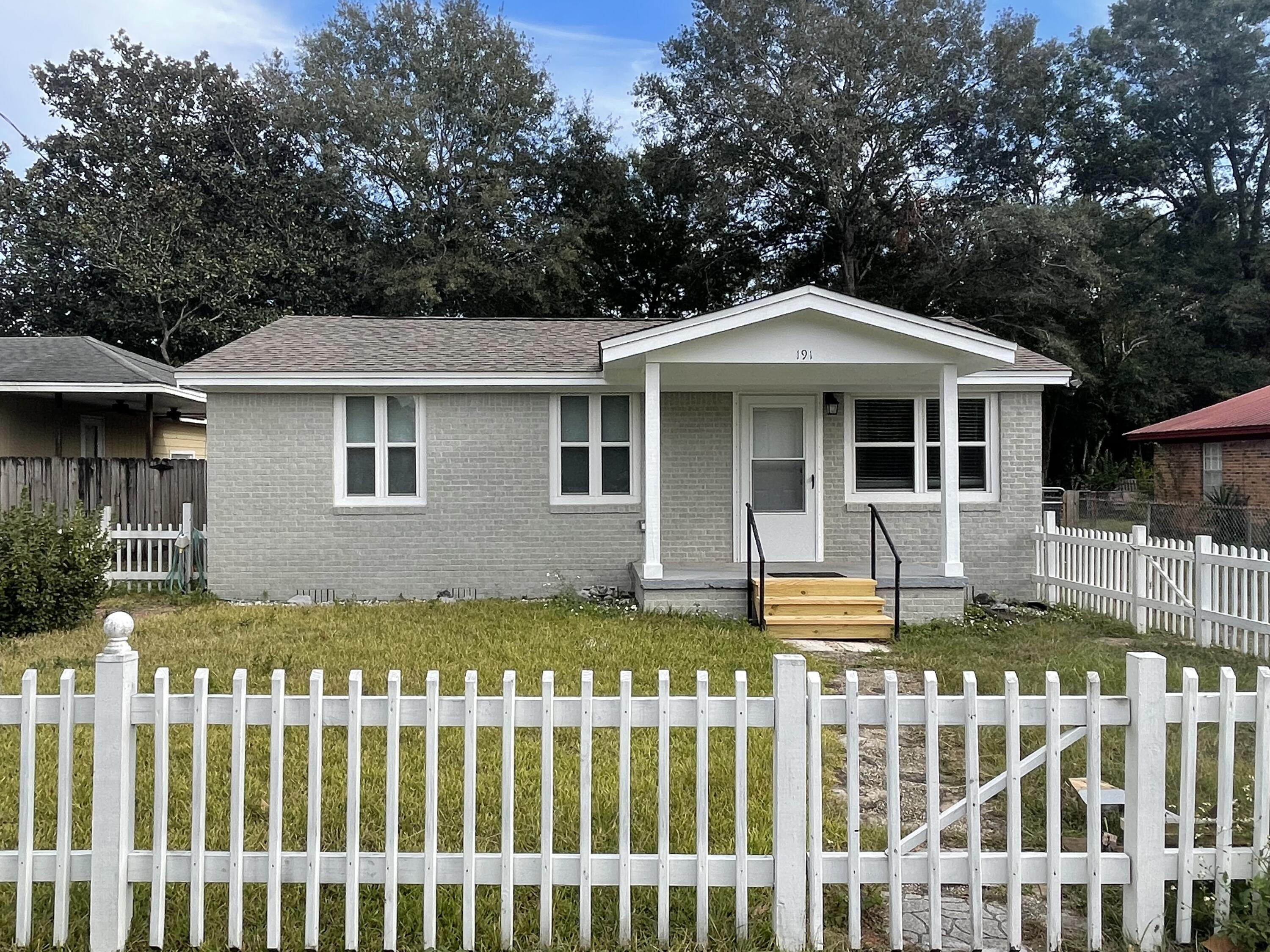 Adorable 2 bedroom / 2 bath home centrally located to shopping & schools. Completely remodeled with hard surface flooring throughout, no carpet! Washer & dryer for tenant use. Screened porch & fenced in back yard.