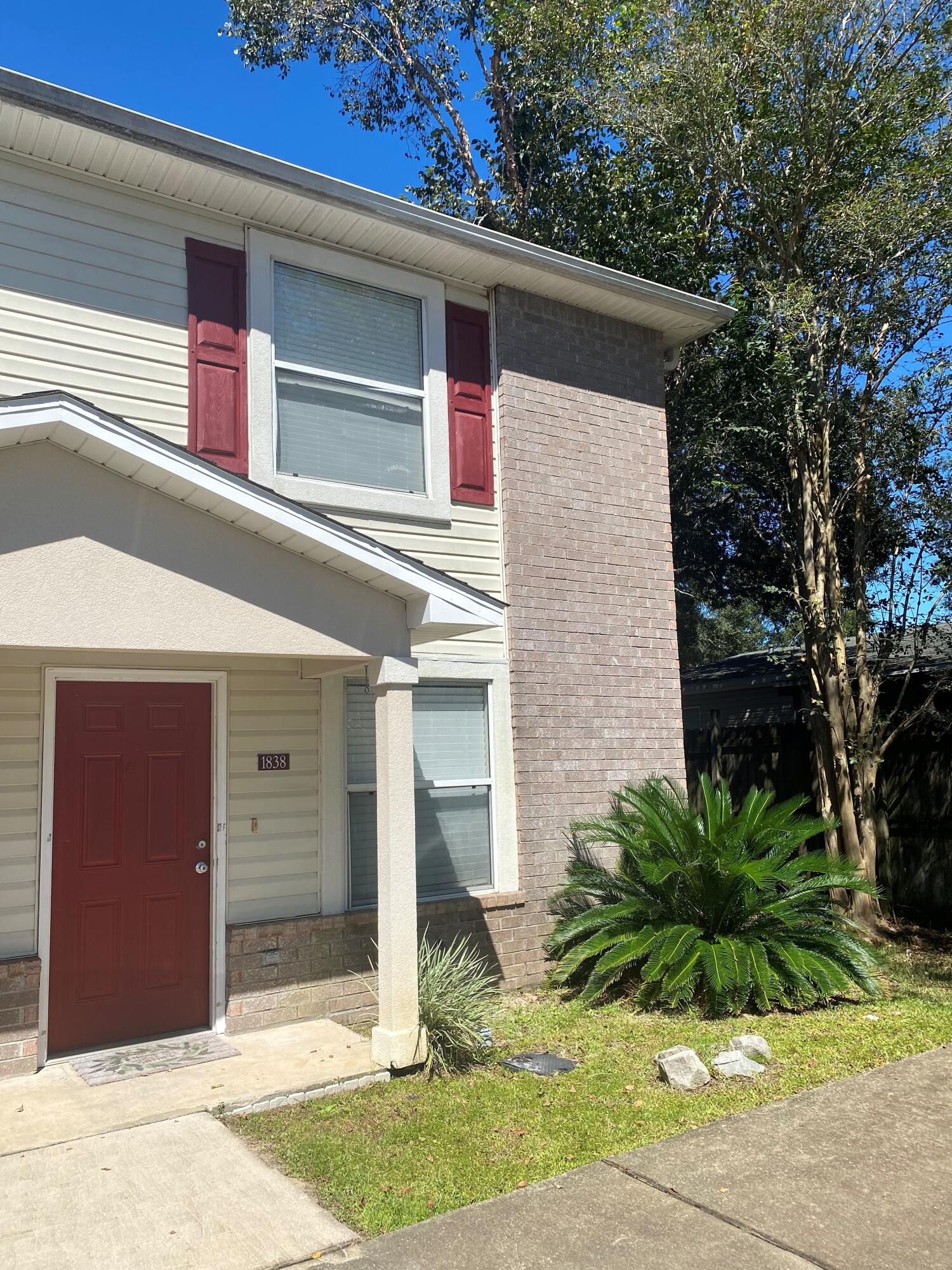Whether you are looking for an investment or wanting to own your first home take a look at this community.  Location is fantastic for proximity to the base and to Destin.  The home offers granite counter tops, backsplash, stainless steel appliances, and plenty of cabinet space.  Tile floors throughout the first floor with new lighting.  The utility room offers additional storage and it comes with the washer and dryer that convey 'As Is'.  A half bath is located under the stairs for your guests.  The master bedroom with large closet and ensuite bathroom. Additional guest bedroom and bathroom. All the bathrooms have new toilets, faucets and accessories.  This facility also has a swimming pool and club house.  Buyer to verify all information.