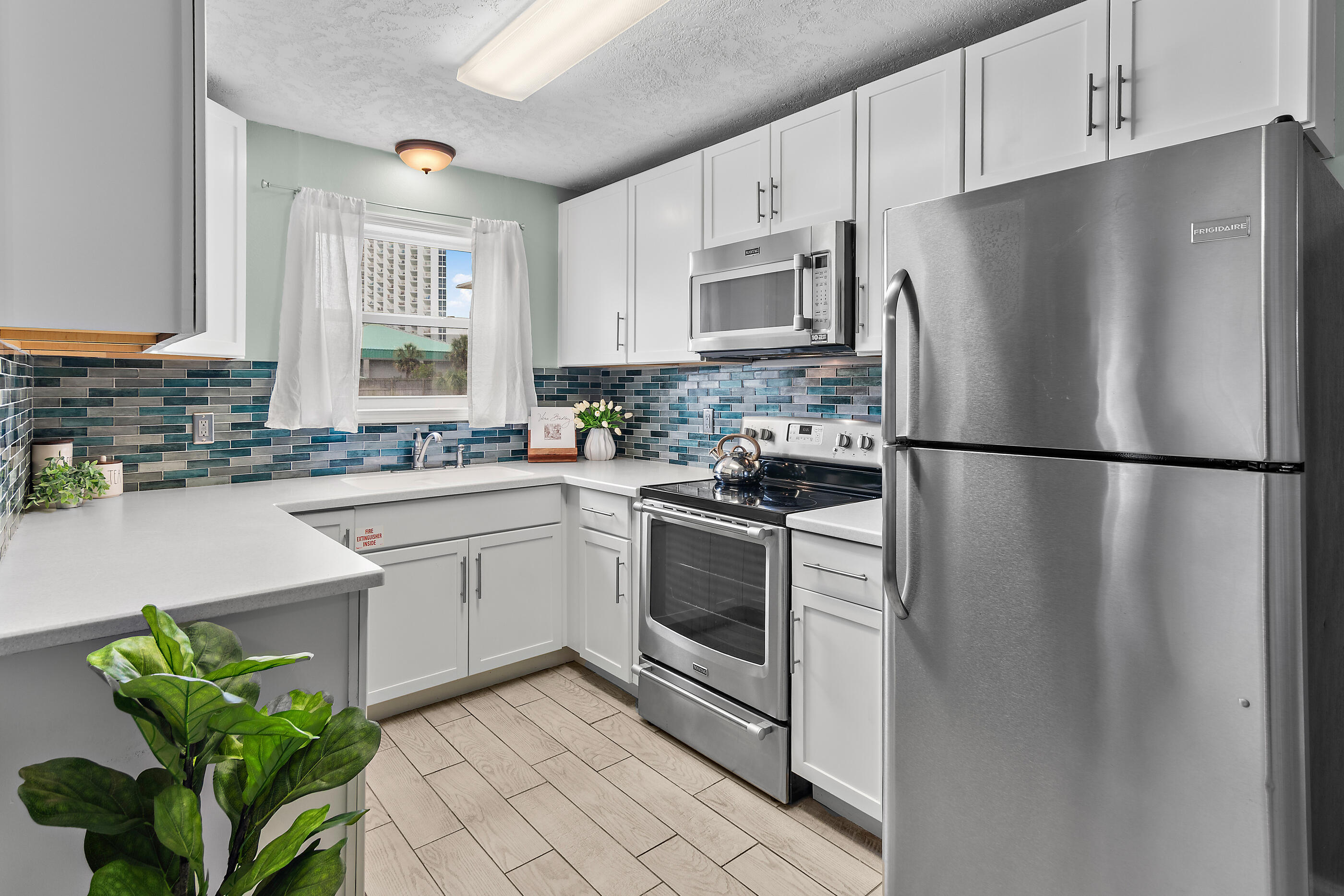 Welcome to your slice of paradise at St. Martin 313—a beautifully updated, turn-key 2-bedroom beach condo located on the ground floor south of Highway 98 in the heart of Destin. Just steps from your private, gated beach access, this unit offers the perfect blend of comfort, convenience, and location. Whether you're looking for a second home or a serene beach getaway, this condo delivers effortless coastal living. Inside, you'll find a stylish coastal kitchen with quartz countertops, a custom backsplash, storybook cabinetry, and stainless steel appliances. Tile flooring flows throughout the space, and the bathroom has been tastefully updated. The unit has a balcony to enjoy the salty air and morning coffee. The St. Martin complex has recently undergone renovations and now features fantastic community amenities including a sparkling pool, tanning deck, picnic area, and outdoor grilling stationsperfect for entertaining or relaxing after a day at the beach.