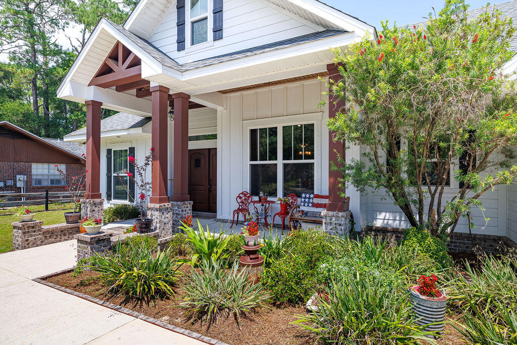 Ever Dreamed of Country Living in the City? We'll look at This!! Click on the photos to discover all the conveniences of this Modern Custom Farmhouse
situated on an almost ½ acre lot! So many wonderful elements make this home built with great integrity by
''Hicks/Locke Const.'' truly special! As you enter the beautiful double front doors to this Open Floorplan home with 18 ft. Cathedral Ceilings, your eye will be
drawn to the gas fireplace wrapped in ship lap all the way to the top, the Hand Designed & Painted Burnt Knotty Pine Cabinets, High Grade LVP Flooring, The Farm Sink & Pot Filler, the Oversized Windows, an incredible pantry, & so much more! Here's the Great News...it has an Assumable VA Mortgage at a rate of 3.375%! Come see it today, make it yours, and love it forever!