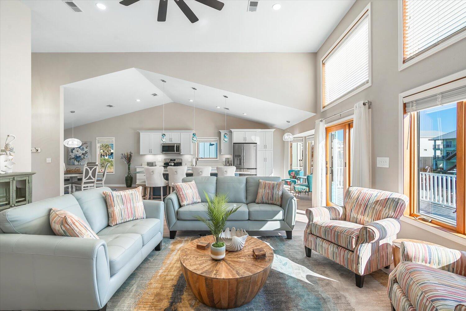 Priced below value! Fully remodeled and furnished, 4 bedrooms, 3 baths, on a deepwater canal, vinyl seawall and 10,000# boat lift.  1 block from the Beach and Gulf, 10-15-minute boat ride to the open waters of the Gulf of Mexico, a trolley stop from restaurants and shops on Pensacola Beach. Professionally furnished with a coastal look and feel. Rental projections of up to $130,000. Kitchen features include-a quartzite center isle with seating for 8, loads of cabinets and storage, all new large and small appliances and is equipped to serve up to 12. In addition, there's a large dining and cozy sunny seating area, the fully furnished open living and entertainment area has everything you and your guests would want.  large bedrooms, one bath and laundry room on the lower level. One bedroom has its own deck overlooking the canal and the other is furnished with 4 bunk beds. There is a large poly table and chairs on the main deck for outdoor dining and lounge chairs on the others as well. This home will make a perfect Primary, Secondary or Vacation Rental property. It is ready for you and your guests to enjoy; all you'll need is to unpack your suitcase. Call for a list of updates and make an appointment to view today. See ya at the beach!