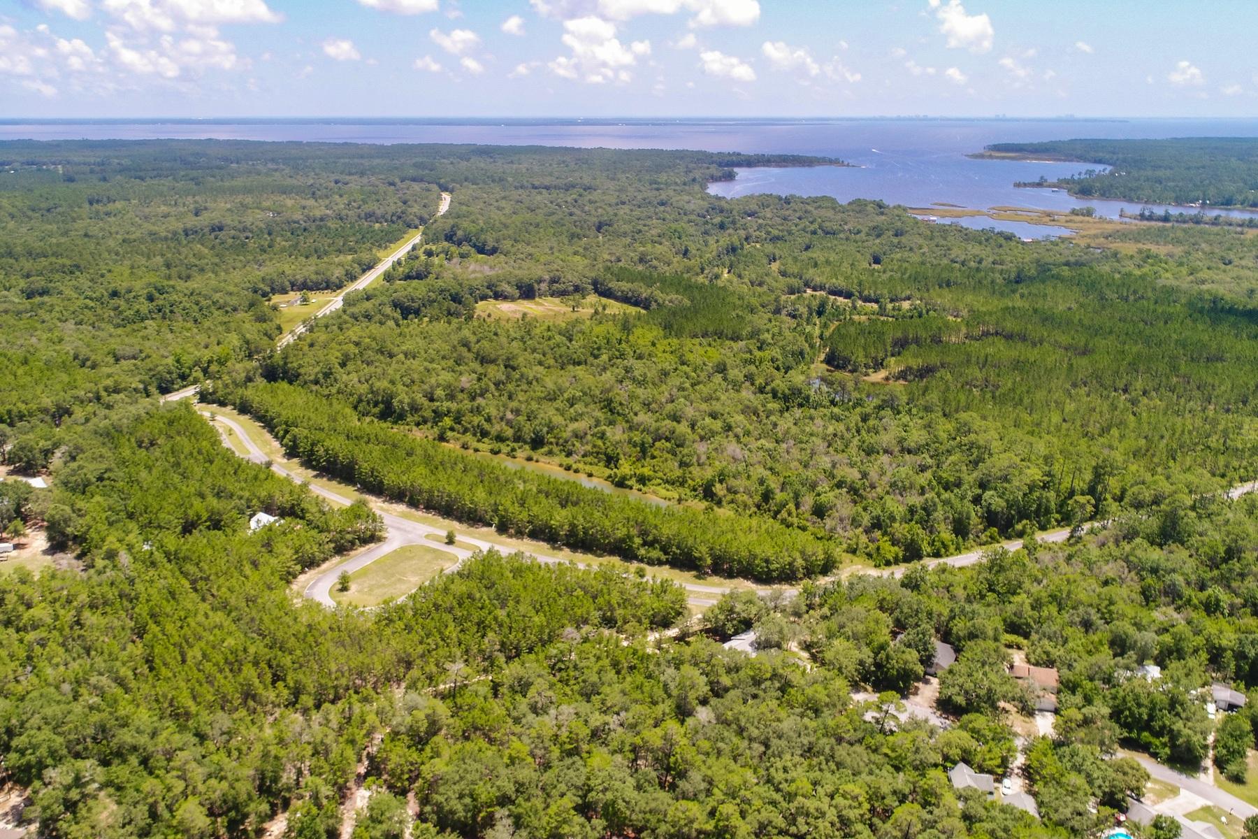 Unique Opportunity For Investors In Freeport. Here is a spectacular one of a kind development opportunity in Hammock Oaks. Sited on approximately 86.89 acres near Hammock Bay, this up and coming community is creating quite the word of mouth as one of the most exciting investments in Freeport. Located near sugary white sandy beaches, this prime master planned residential community is a must see for those that want unlimited creative control in design and construction.