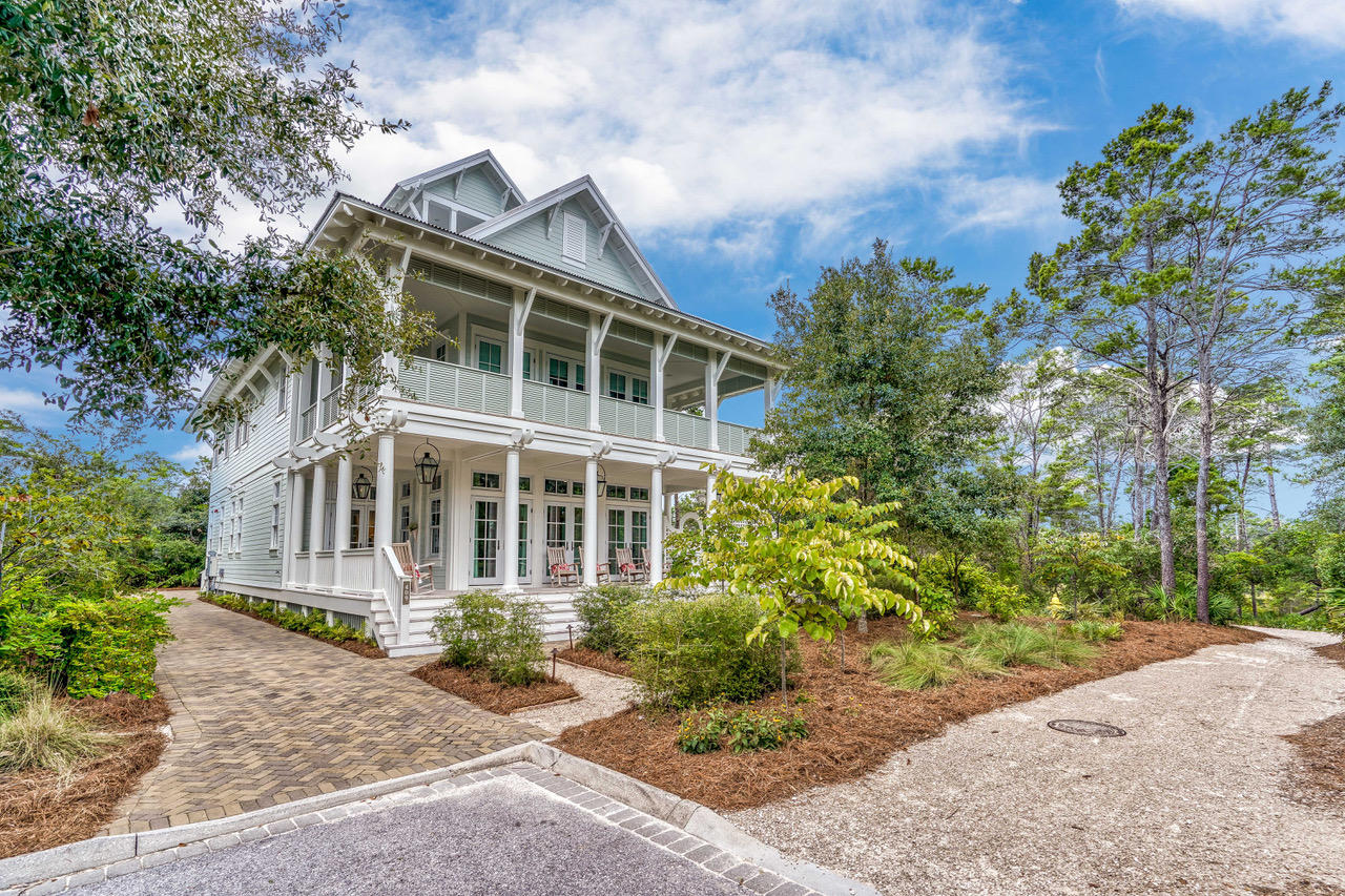 Gracious Southern living blends effortlessly with the distinctive 30A landscape at this extraordinary 6BR/6BA WaterColor residence with gorgeous views of Western Lake throughout and peekaboo views of the Gulf and the Seaside community from the fourth story tower. Spacious wraparound verandas and classic white columns welcome you inside where the interior finishes will stun with impeccable attention to every detail and the finest display of craftsmanship. Convenient to all the amenities of WaterColor, this property offers a rare sense of privacy nestled at the end of a quiet street flanked by preservation land along the shores of Western Lake. An inviting lap pool with lounge areas on both ends runs the length of the main home which offers open concept living and dining spaces perform for gathering.

Designed and furnished by Erika Powell of Urban Grace Interiors, highlights include soothing blue shiplap ceilings, white shiplap walls, seven sets of French doors, wide plank hardwood floors, transom lighting and abundant natural light. At the heart of the home, find an elegant kitchen that will fulfill every wish with Wolf and Sub-Zero appliance, white marble counters, a large center island with two farmhouse sinks and custom cabinetry that includes a hidden flat screen tv. Nano doors fully unite this space with a screened porch overlooking the lap pool. Additional features of the first level include a wet bar, first floor office space, commercial-style laundry room and a beautiful guest suite.

On the second level, find a playful bunk room with four built-in bunks along with two additional guest suites and a secondary laundry room. The serene master suite is also on this floor with double doors that open to a private porch and a luxe master bath with a glass shower with rainfall shower heads, a large soaking tub, dual vanities and a walk-in closet with built-in storage. Wraparound porches provide additional living space including a custom ping pong table for added fun. The third story offers a cozy home theatre, a work-out room, a wet bar and a desk space. The fourth floor tower includes a bright and sunny room with built-in trundle beds and access to two private balconies with spectacular views.

A detached carriage home over the two-car garage is ideal for guests with a fully equipped kitchen, a separate bedroom and a loft area with additional sleeping space. Immaculately cared for by the owners, this property has not been rented yet offers an incredible amount of space for someone seeking an investment property in WaterColor.

Located on 499 aces in the renowned South Walton beach, WaterColor was created with families in  mind and offers the charm of small-town life. Exceptional community amenities include six beautiful swimming pools, a Gulf front beach club, nature trails, a Boathouse offering kayaking, canoeing and paddle boarding, a fitness center, outstanding tennis facility, Camp WaterColor for kids with lazy river and waterslide, parks and green spaces.