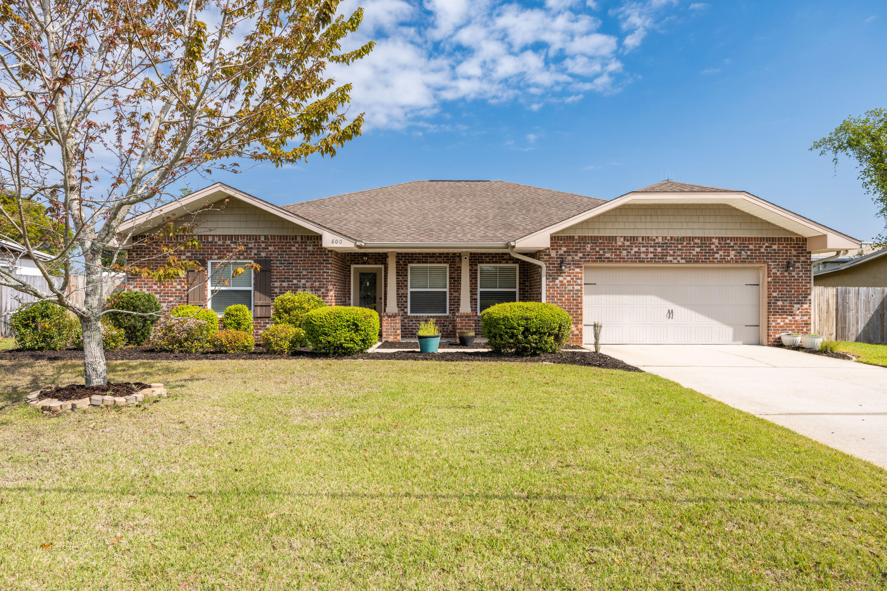 This stunning Tracey Acree-built home offers the perfect blend of modern elegance and everyday comfort. With 10-foot ceilings, crown molding, and a semi-open split floorplan, this 10-year-old gem is designed to maximize space and natural light. The spacious bedrooms and bathrooms feature laminate and tile flooring throughout making maintenance a breeze. 

At the heart of the home, the dream kitchen is a chef's paradise, complete with a built-in commercial-style fridge and freezer, granite countertops, and rich maple cabinets. Whether you're hosting guests or preparing family meals, this kitchen is as functional as it is beautiful. The luxurious master suite is your private retreat, featuring two walk-in closets, dual vanity sinks, a spa-like shower, and a relaxing whirlpool tub. The secondary bedrooms are equally spacious, making this home ideal for families of all sizes.

Step outside to a covered back patio that overlooks a fully fenced backyard, offering ample space for a future pool, garden, or a play area for kids and pets. With a large two-car garage and an extended driveway, there's also room for boat or RV parking.
Located in a desirable neighborhood just minutes from shopping, dining, both Air Force bases, and the world's most beautiful beaches, this home also enjoys proximity to a family-friendly park with playground, basketball court and a baseball field.
Don't miss your chance to own this incredible home. Schedule a showing today before its gone!
