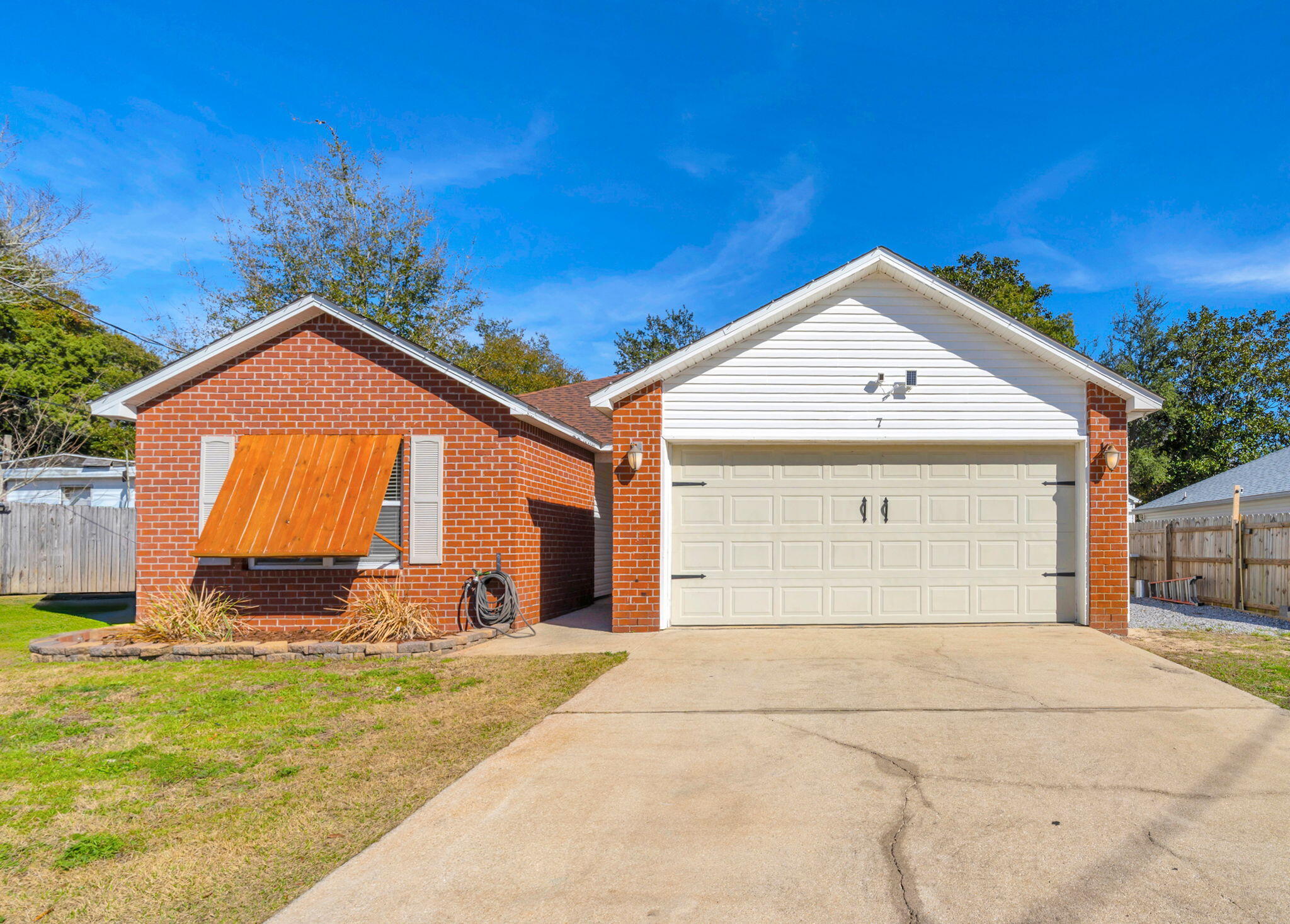 South of 98 | Under 4 Miles to Hurlburt | Boat/Trailer Parking | Move-In Ready
This beautifully maintained home offers space, smart updates, and an ideal location for an easy commute to Hurlburt Field -- all less than 4 miles away and south of 98.
The split-bedroom floor plan provides both functionality and privacy. The living room features a tray ceiling and crown molding, creating a warm and inviting space that flows seamlessly into the kitchen and dining area. The kitchen includes a breakfast bar, stainless appliances (replaced in 2025), and all appliances convey. The oversized primary suite is spacious enough for a king-sized bed with room to spare and includes a large walk-in closet. The primary bath features double vanities, a tub/shower combo, and separate walk-in shower. Both guest bedrooms accommodate queen-sized beds comfortably. The guest bath, located between the bedrooms, also includes double vanities and a shower/tub combination.

Recent updates and features include:
" Roof replaced in 2022
" Water heater replaced in 2022
" Fresh interior paint (2022)
" Stainless appliances (2025)
" Updated lighting in select rooms
" Faux wood blinds
" Tray ceiling & crown molding
" Laminate flooring in bedrooms
" Tile in kitchen and baths

Outdoor highlights:
" Privacy fenced backyard
" Sodded yard
" Covered patio
" Added deck with railing
" Double gate
" Dedicated boat/trailer parking with rock boat pad
" Public sewer

Located in a limited traffic area with quick access to Navarre and Fort Walton Beach. Move-in ready and packed with value.