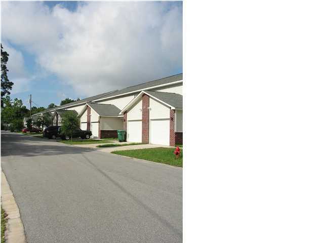 About 5 miles from Eglin AFB and 20 miles from Hurlburt AFB. This well maintained 3 bedroom, 2.5 bathroom townhome is priced to rent. Kitchen includes lots of cabinetry, tiled floors, black appliances (refrigerator, stove [electric], built-in microwave, dishwasher) and garbage disposal. Kitchen overlooks large living room/dining room combo. Downstairs also includes half bath and storage under stairs. Garage includes washer/dryer hook-ups and automatic garage door opener. Upstairs includes master bedroom/bath and two additional bedrooms. Lawn maintenance included in rent. No smoking in rental please.