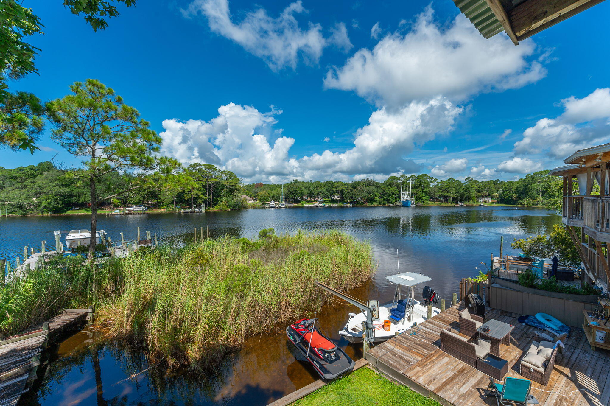Introducing a stunning waterfront townhouse in Niceville. This spacious 3-bedroom, 2-bathroom home boasts an open and bright layout, perfect for enjoying the picturesque views of the water. The modern kitchen features stainless steel appliances and granite countertops, with subway tile backsplash ideal for preparing meals and entertaining guests. The luxurious master suite overlooks the water, providing a peaceful retreat at the end of the day. Master bath offers a walk-in shower. Take advantage of the dock and slip and keep your boat right outside your back yard.  Unit location provides an easy commute to bases and schools. This townhouse offers both comfort and convenience for its residents. Experience waterfront living at its finest in this beautiful townhouse!