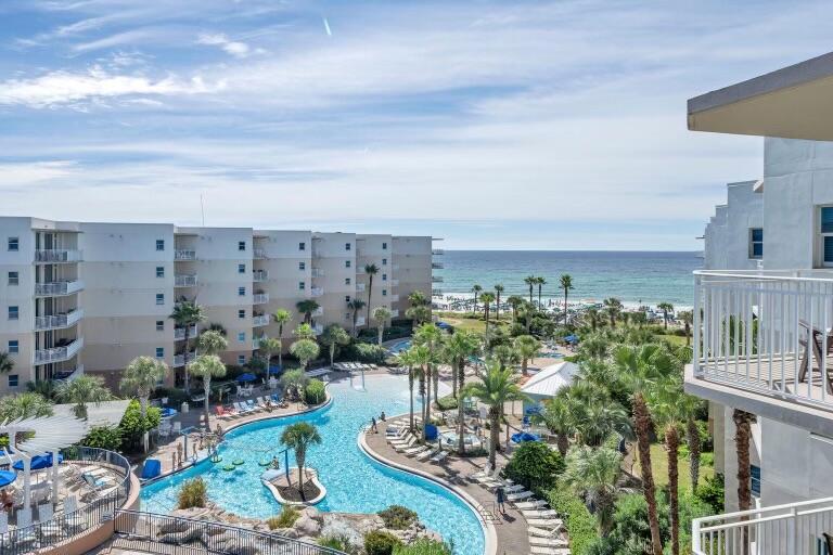 OPEN HOUSE NOV 4-6th! EXCLUSIVE Top floor unit with BEACH ACCESS, GULF VIEWS from the PRIVATE BALCONY, and spectacular views of the island and bay from the bedroom! This completely renovated unit has brand new cabinetry and granite countertops, flooring, hot water heater, washer/dryer, appliances, bidet toilets, and updated showers with a lifetime warranty! COMPLETE with a custom new HVAC and Aeroseal system with an upgraded UV air cleaner, this unit reduces dust and improves system efficiency by 45%. Great for those concerned with air quality!   This home is priced to sell and offer buyers the most return for their investment! Schedule your private showing today; all offers are due by 6 p.m Sunday, Nov. 6th!  This much luxury at this price is hard to find!