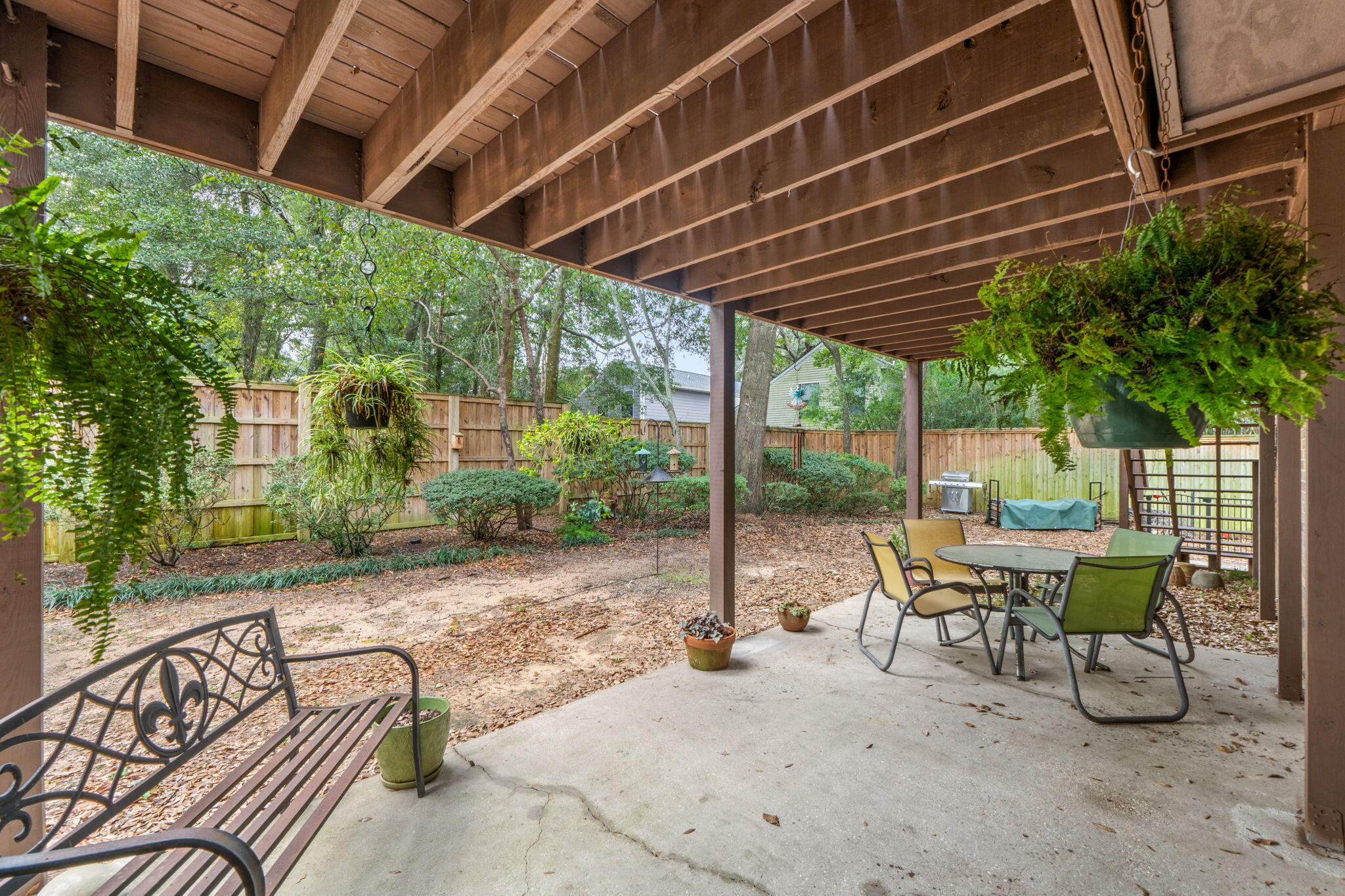 From the moment you step in the door you can see how Perfectly maintained and sparkling clean this 3 bedroom 2 bath condo on E Olive just off Scenic Hwy is. Gorgeous location under magnificent oak trees in a 16 condo community. Ground floor condo with a large back patio with trees behind for added privacy and an oversized 1 car garage. French doors open from the living room to the outdoor living on the covered back patio.The updated kitchen has tons of cabinets, stunning countertops, stainless appliances and a window seat to enjoy the view. French doors from the kitchen also open to the back patio. Great sized primary bedroom with an updated bathroom - tile shower. The other bedrooms share the updated hall bath. 2025 Assessment paid in full by the seller!