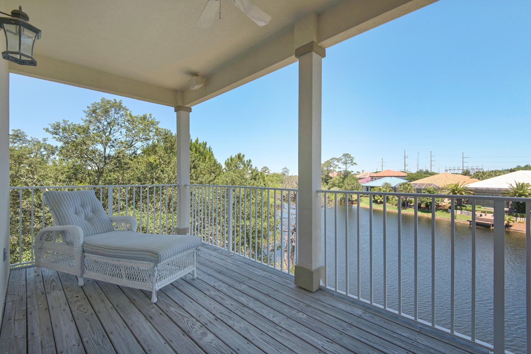 Best-priced, immaculate lakefront home in Destiny just one block from the beach! Upon your return from a day at the beach, you will enjoy a tranquil setting on your private deck overlooking the lake. The open floor plan with the living room, kitchen and dining area all on the first floor, are all focused on the beautiful lake views. There's also a wet bar for ultimate entertaining. The bedrooms are on the second floor, with another living area and balcony access. The master suite is large with sliding doors to a private balcony. In the master bath you'll enjoy a garden tub, separate shower, double sinks and a sit down vanity. Each guest room has a private bath. There is a single car garage and a storage closet. There is plenty of room for a private pool if so desired. Destiny is a gated community, conveniently located to restaurants, golf, and shopping. It boasts a clubhouse with a large community pool, hot tub, gym, and tennis court and is a nice mix of full time homeowners and rental properties. This would be a great primary or secondary residence or an investment property with gross projected rental income to be just over $62,000.   Don't miss owning a lakefront home at this price!