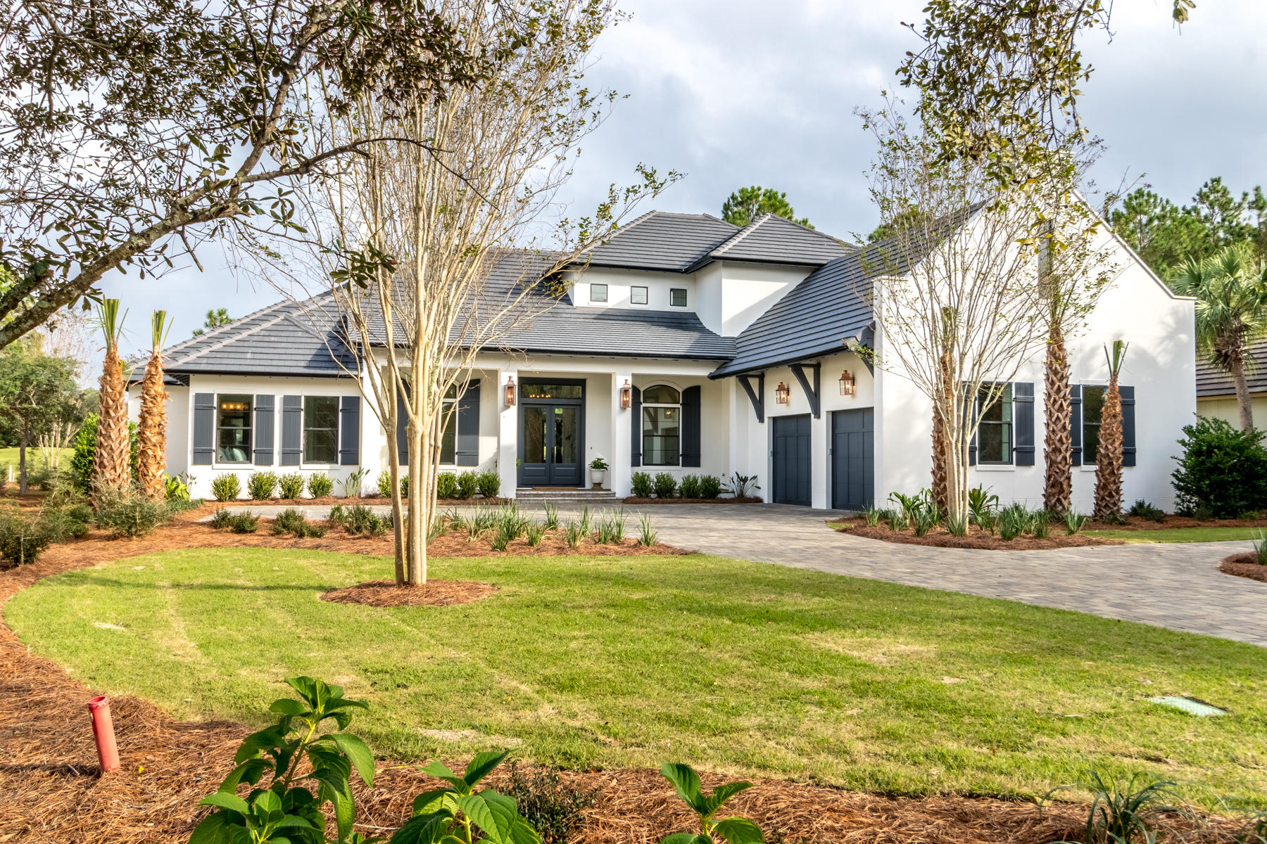 Located on the 7th hole of the Raven golf course, with its high ceilngs and clean lines this Alys Beach inspired home is one of the newer built homes in Burnt Pine . Located in the exclusive Burnt Pine community of Sandestin, the open floor plan features four bedrooms and a separate office. Natural light floods the house in every room. Relax in the master suite where you have cathedral beamed ceilings and a master bathroom right out of a magazine. The master bathroom exudes relaxation with ship lap walls,a custom bathtub, split vanities, a makeup area and large walk-in shower. The separate his and her closets complete the master suite. The kitchen features a separate refrigerator and freezer,2 dishwasher drawers, ice maker, & two sinks and an kitchen wall is stunning with in layed marble to the ceiling.  The views from the kitchen will make you love to do the dishes!! The butler's pantry features plenty of counter space and a wine cooler. 

The open living space will make entertaining easy. With custom beams, custom painted wood cathedral ceilings, shiplap fireplace from floor to the top of the cathedral ceiling, 17th century french barn doors and the seamless flow from indoor to outdoor living this home has everything.

The second floor has two large bedroom suites, a sitting area and a movie room.  There are 2 high capacity tankless water heaters, 18 seer AC units, prewired for sound and security.  There are two fireplaces.This home has a 30A feel with the advantage of Sandestin living.Deep Two car garage PLUS a full golf car garage. There is room to expand the garage to add 2 more garage spaces or add a carriage house. Enjoy the large salt water pool with a layout deck in the pool and a large spa. Heated of course.    It in NOT in a flood zone.

There is approximately 3000 square feet of heated and cooled living space on the first level and approximately 1200 feet of living space on the second level.  Total under roof area is approximately 5800 feet.