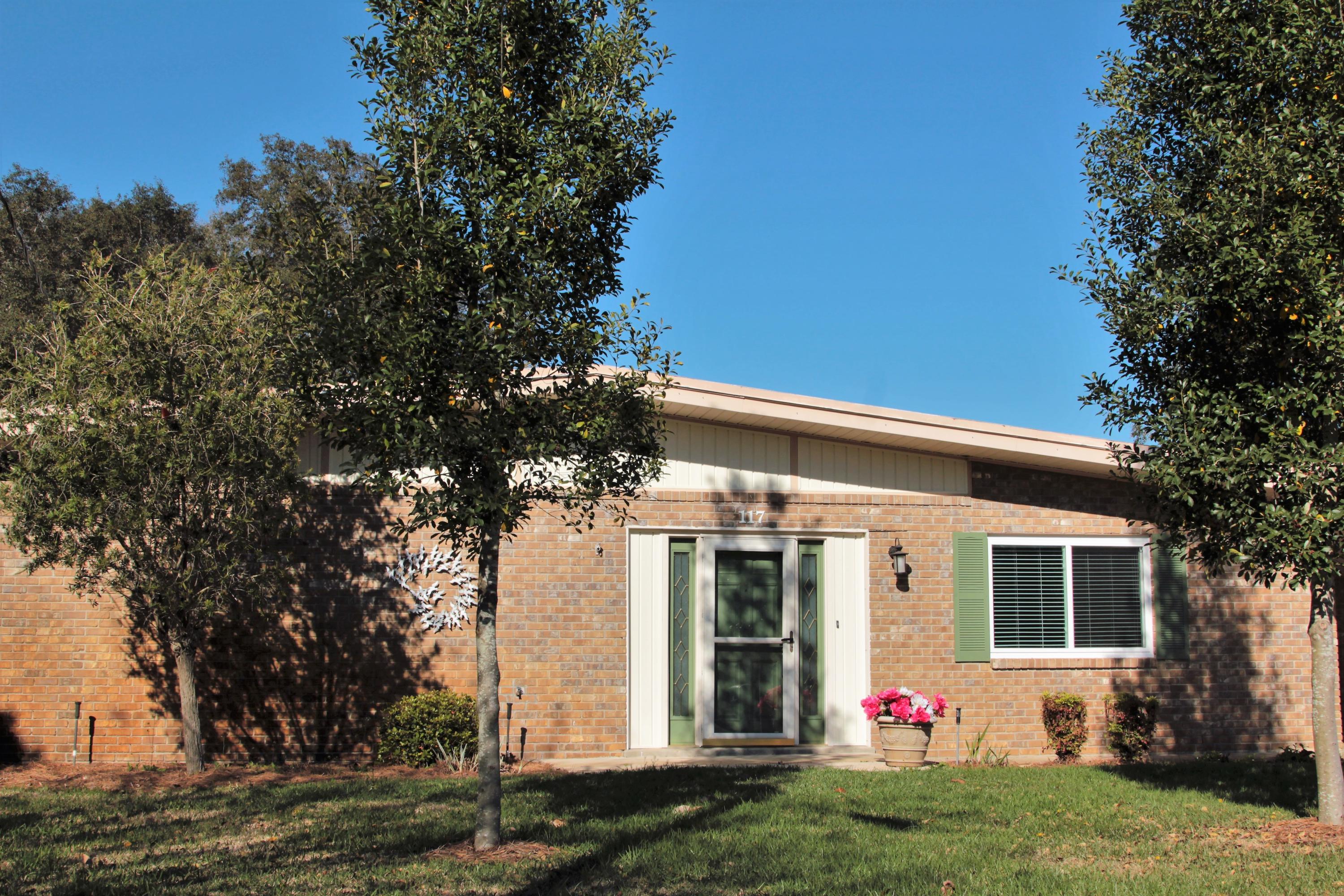 Move in ready! You will love this beautiful home that is all about location, location, location! Located at the end of a quiet cul-de-sac, you will be thrilled with great neighbors and space galore! Elementary school and Ferry Park only one block away. Uptown Station and Fort Walton Yacht Club within walking distance! Only two miles to the beach, Downtown Fort Walton, and the Fort Walton Beach Landing! Stroll or jog on walking trails nearby. Master bedroom has new carpet with an adjoining room for your office or nursery. Master bath has double-sink vanity and walk-in shower. Beautiful tile flooring throughout the house. Full bath located in a second bedroom. Two additional bedrooms are ideal for your growing family! Galley kitchen leads to pantry, laundry, and indoor work space. Built in bookcases and display shelves add so much charm! The large screened-in back porch is perfect for entertaining! Huge backyard with mature trees and lots of room for gardening. Outdoor workshop/storage building has work bench, power, and lights. Plenty of parking with attached single car carport and two-car parking slab. Don't miss out on this great gem in the perfect location!