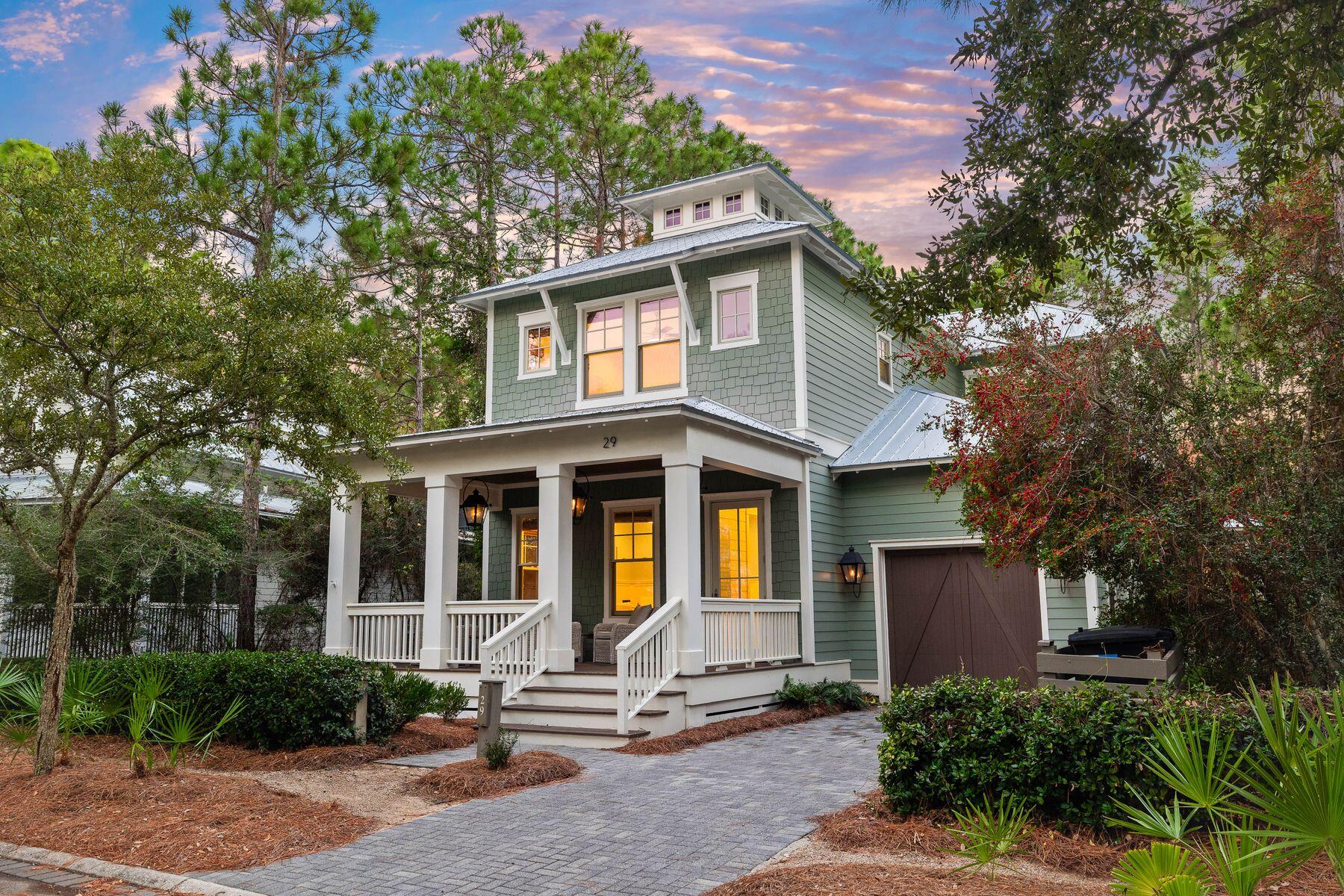 Perfectly positioned in the heart of WaterColor, this beautifully designed home offers space, style, and versatility—ideal for hosting, relaxing, or enjoying the beach lifestyle with family and friends. With four bedrooms, four-and-a-half baths, a dedicated bunk room, and a separate office that could easily be converted into an additional bedroom or bunk room, the layout provides flexibility for a variety of living arrangements. A charming paver walkway leads you to the welcoming front porch, where gas lanterns set the tone for the timeless coastal design found throughout. Inside, a soaring 25-foot foyer makes a striking first impression, flanked by a private study behind French doors and a staircase leading to the upper level. The open-concept living and dining space showcases high ceilings, hardwood floors, shiplap accents, and walls of windows that frame serene views of the lush natural landscapeoffering both privacy and beauty.

The gourmet kitchen is a showstopper, outfitted with Thermador appliances, white custom cabinetry, quartz countertops, and a coastal tile backsplash that flows into a convenient built-in desk nook. A spacious center island is ideal for entertaining, while the formal dining area is anchored by a bold statement light fixture. Just off the main living space, a large screened porch invites relaxed evenings and effortless indoor-outdoor living.

The first-floor primary suite offers a peaceful retreat with shiplap detailing, a coffered ceiling, and a spa-inspired ensuite featuring dual vanities, a soaking tub, and a walk-in shower. Upstairs, a cozy loft provides a second living area perfect for movie nights or quiet reading, while each guest bedroom has its own private bath for added comfort and privacy.

Additional highlights include a single-car garage ideal for storing a golf cart or beach gear, plus off-street parking for 2-3 vehicleswith the potential to extend the pavers to meet additional parking requirements if desired.

Enjoy all that WaterColor has to offer with easy access to the community's many amenities: multiple pools, the WaterColor Beach Club, Camp WaterColor's lazy river, tennis courts, nature trails, and nearby shops and restaurants. With the Gulf of Mexico just minutes away, this home is your gateway to the ultimate 30A lifestyle.