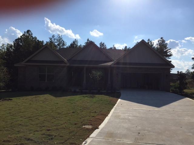 Come buy our BEAUFORT in our HAMMOCK BAY community located in Freeport FL. This BEAUFORT offers 2745 SF of living space with 4 large Bedrooms and 3 full Baths plus a Living Room/Office. As you enter the BEAUFORT from the covered front porch the wide foyer opens to a large Dining Room and Living Room/Office. Continue to the 20'x17 Family Room with an entire wall of windows, coffer ceiling and open Kitchen. The Family Room also has a gas fireplace. The Kitchen has granite countertops, an island and 42 cabinets. Just off the Kitchen is a screened in porch that's perfect for relaxing or entertaining family and friends. The Master Suite includes a large walk-in closet, double vanities, tiled shower and garden tub.