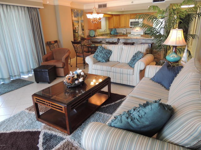 BEST OF THE BEST IN WATERCREST!**WESTERN FACING CORNER UNIT AND WRAP BALCONY** Raising the standard of beach living, this highly upgraded condo flaunts the splendor of the sun drenched surf with the beauty of inspired interiors. This stunning END unit has a rare true wrap-around balcony. Beautifully furnished and appointed including upgrades like stainless steel kitchen appliances, granite counters in the kitchen & bathrooms, and hard surface flooring throughout living area. Wide open floor-plan perfect for entertaining! Residing by the famed St. Andrews State Park and directly on the beach, this condo marries coastal design with chic beach living. This rare find certainly offers the best of beach living with all the comforts of home.