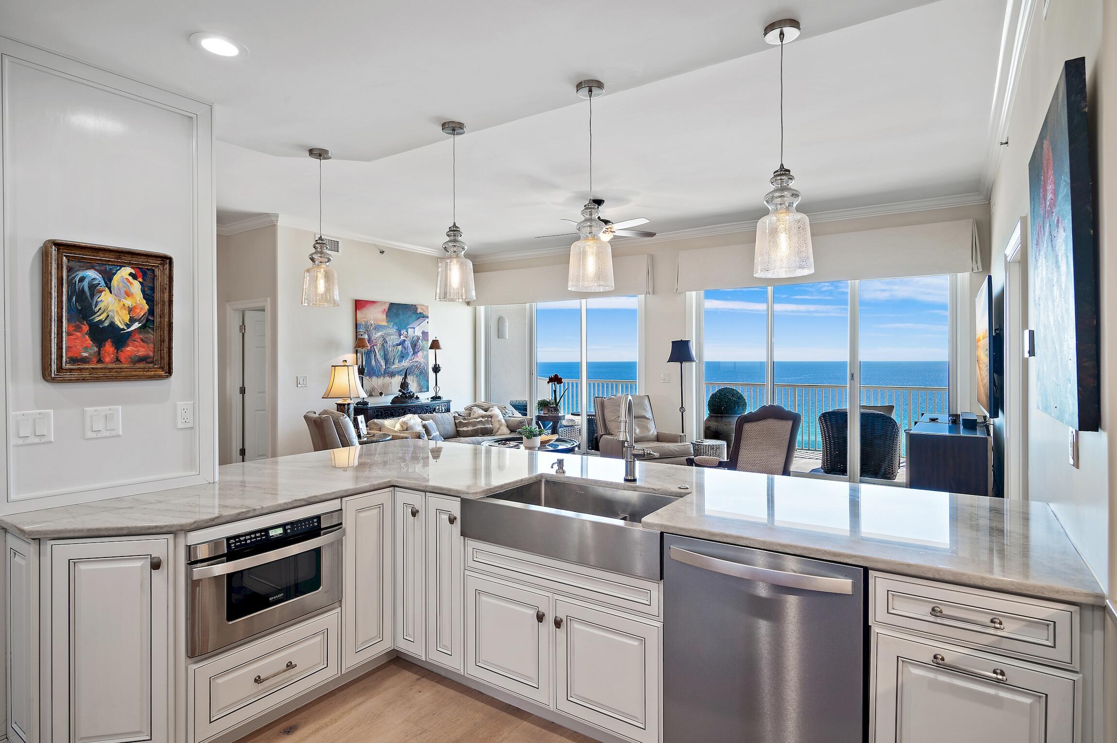 Welcome to Empress, where luxury living meets breathtaking Gulf sunset views. This spacious 10th-floor condo boasts 10-foot ceilings and separate climate-controlled storage. With a complete upgrade, including the removal of the center wall to create an open floor plan and enjoy unobstructed views of the gulf, bay, and resort lake.
The expanded kitchen features high-end finishes, a gas range and double ovens, perfect for culinary and entertaining enthusiasts. A stunning wet bar and gas/ventless fireplace adds warmth and ambiance to the living space. Upgraded hardwood flooring and ceiling lines enhance the modern aesthetic throughout.
Retreat to the elegantly redesigned bathrooms and spacious walk-in closets for ultimate comfort and convenience. For further details, click More.... Enjoy peace of mind knowing that your home is equipped with an updated HVAC system and dual hot water heaters, including a tankless unit (new since 2018). 
This condo comes with one assigned covered garage parking spot for added convenience. Amenities include a pool, hot tub, and fitness center overlooking the serene lake.
Experience coastal living at its finest at Empress. Schedule your private tour today and embrace the luxury lifestyle awaiting you.