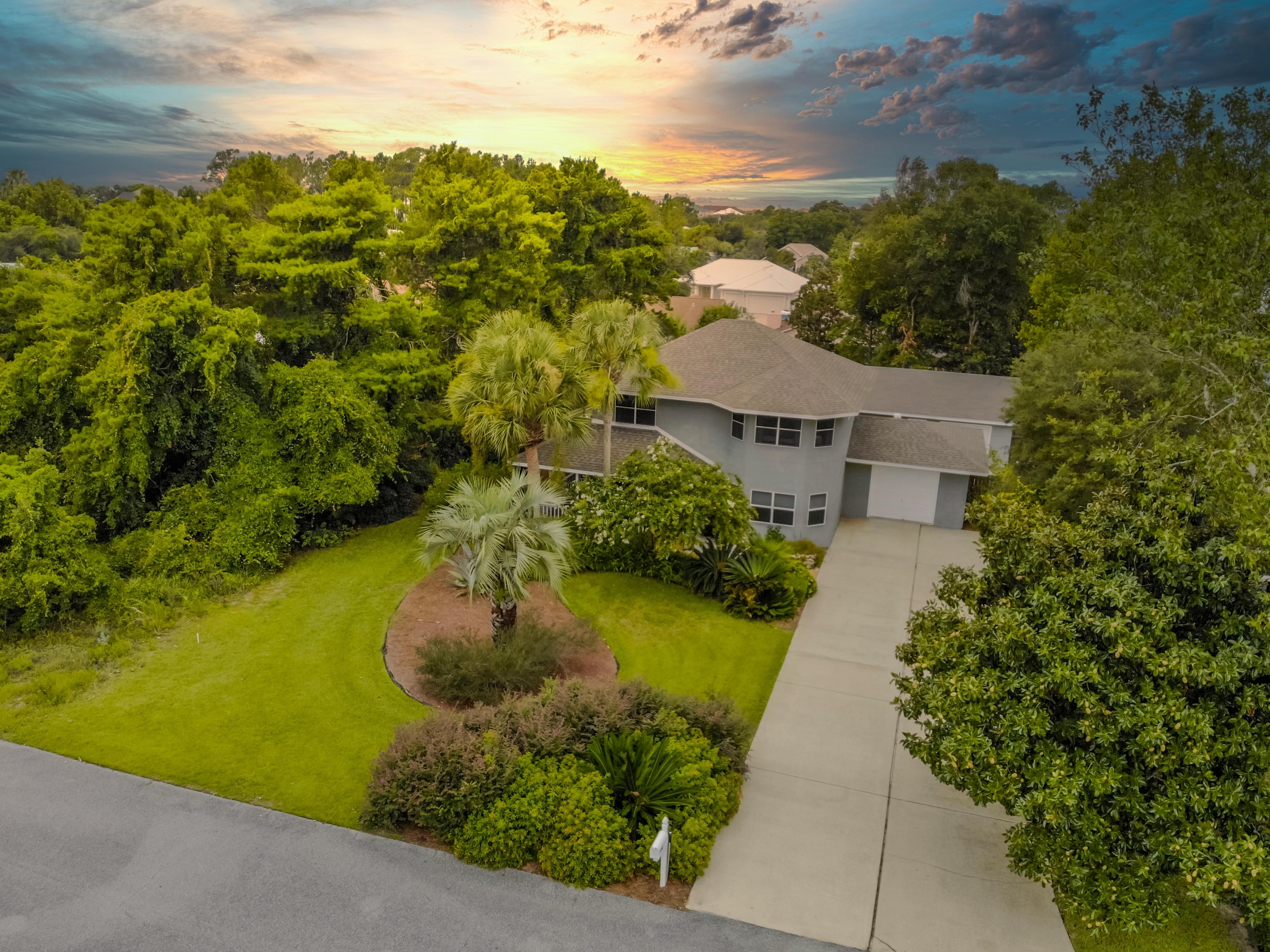 Live in paradise in this 3 bed, 3 bath home located in the beautifully landscaped community of Gulf Vista in the heart of Sunnyside. Property is located less than 1/2 mile from public beaches. This home is the perfect space for any size family and provides a unique and comfortable living arrangement for any family dynamic.  The climate controlled Florida room offers a cool, relaxing environment for reading a good book in the warm days of summer and a perfect space to enjoy a cup of coffee during cold chilly mornings. Front yard is meticulously landscaped and the private fenced back yard is a tropical paradise with covered pergola/sitting area. There is a 720 sqft. heat/cooled separate structure with private driveway that can easily be converted into a carriage home for guest and family.