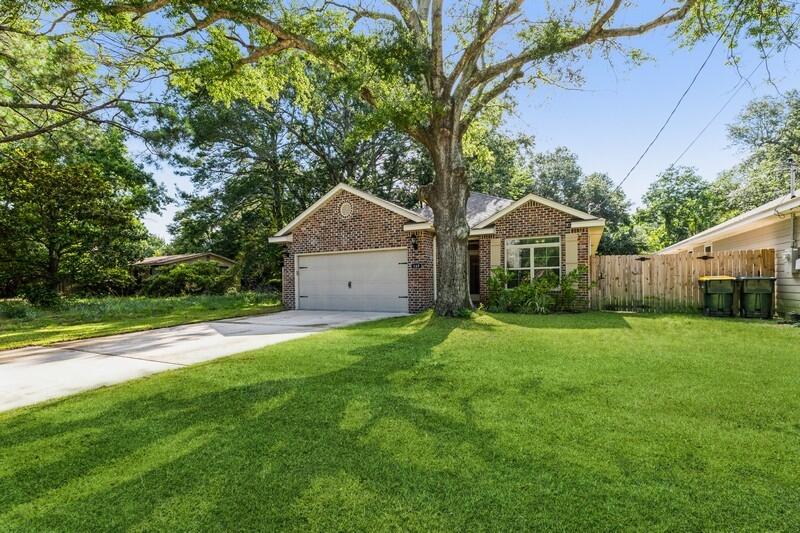 Welcome home!! Make this beautiful NEARLY NEW craftsman home 3 bedroom 2 bath home yours today. Split floor plan w/ open concept Buyers have come to expect. Just minutes from HWY 98 and the white sandy beaches of the Emerald Coast! Easy commute to Military Bases, shopping, and schools. As you enter this home you will be greeted with a spacious living room, beautiful wood-look tile flooring. Living room opens to a beautiful kitchen/dining room w/ beautiful cabinetry, granite countertops, tile backsplash, breakfast bar, SS appliances etc. Master bedroom offers beautiful tray ceilings, large master bathroom and huge master closet. Two additional bedrooms & extra full bathroom. This home offers a spacious privacy fenced backyard for entertaining. Two gar garage w/ storage. A must see property!