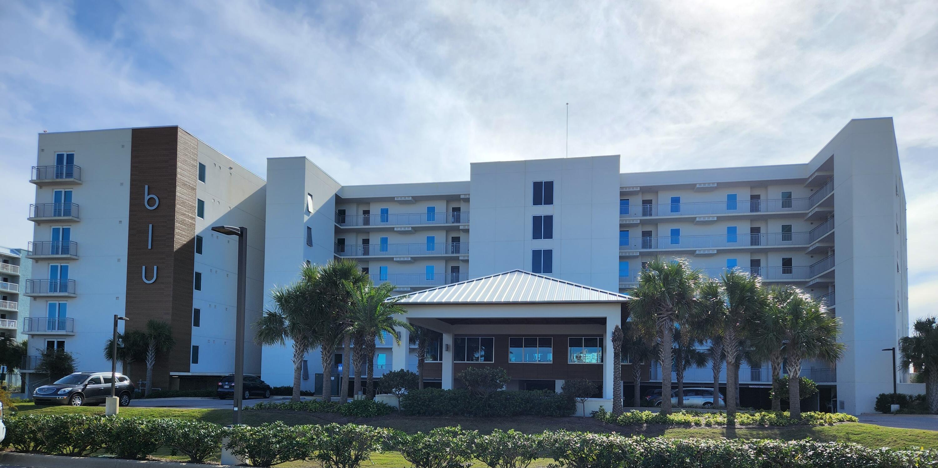 The BLU is the quintessential gated waterfront condo that is known for coastal opulence contemporary living on the beautiful beach of Okaloosa Island. This fully furnished 4th floor, three-bedroom + media room, three-bathroom unit boasts 1,837 square feet of luxurious living space featuring endless views of the Gulf . With exquisite features and modern amenities, it's a perfect blend of style and comfort for a primary, secondary residence, or investment property. Upon entering you will immediately notice the exquisite fixtures and finishes, from the porcelain tile flooring throughout, open floor concept, 29' balcony, to the frameless shower doors in each bathroom. The kitchen features quartz countertops, designer cabinetry, recessed lighting, large island w/ barstools, stainless steel appliances, and blue stone backsplash. Upon entering the unit, there are two spacious bedrooms, each with their own full bathrooms - also with quartz countertops, double vanities, and step-in showers.The master bedroom suite is also gulf front and has private balcony access. Showcasing a luxurious bathroom - with linen closet, double vanity, quartz counters, soaker tub, separate shower w/ frameless doors, and private water closet.  The 4th bonus room, currently being used as a 4th bedroom for extra sleeping space, can easily be transformed into a media room, or even a private office space. Also included in the unit is a laundry room with full size washer and dryer, large on-demand water heater, private owners closet. The BLU is 6 stories, constructed with solid concrete / steel, each unit has high impact / high efficiency windows and doors with tinted blue glass, and is gated to offer safety, security, and privacy. The opulence contemporary design is continued into the amenities of the BLU with a state of the art fitness center, 2 gulf front pools, one being heated from fall to spring, for year round enjoyment, large pool dressing / restrooms, large sundeck, jetted spa, gulf side fire pit, BBQ grills w/ picnic area, private gated beach access, and this unit is one of few units that conveys a DEEDED COVERED PARKING SPACE (1) + STORAGE LOCKER. Owners are allowed 2 pets.