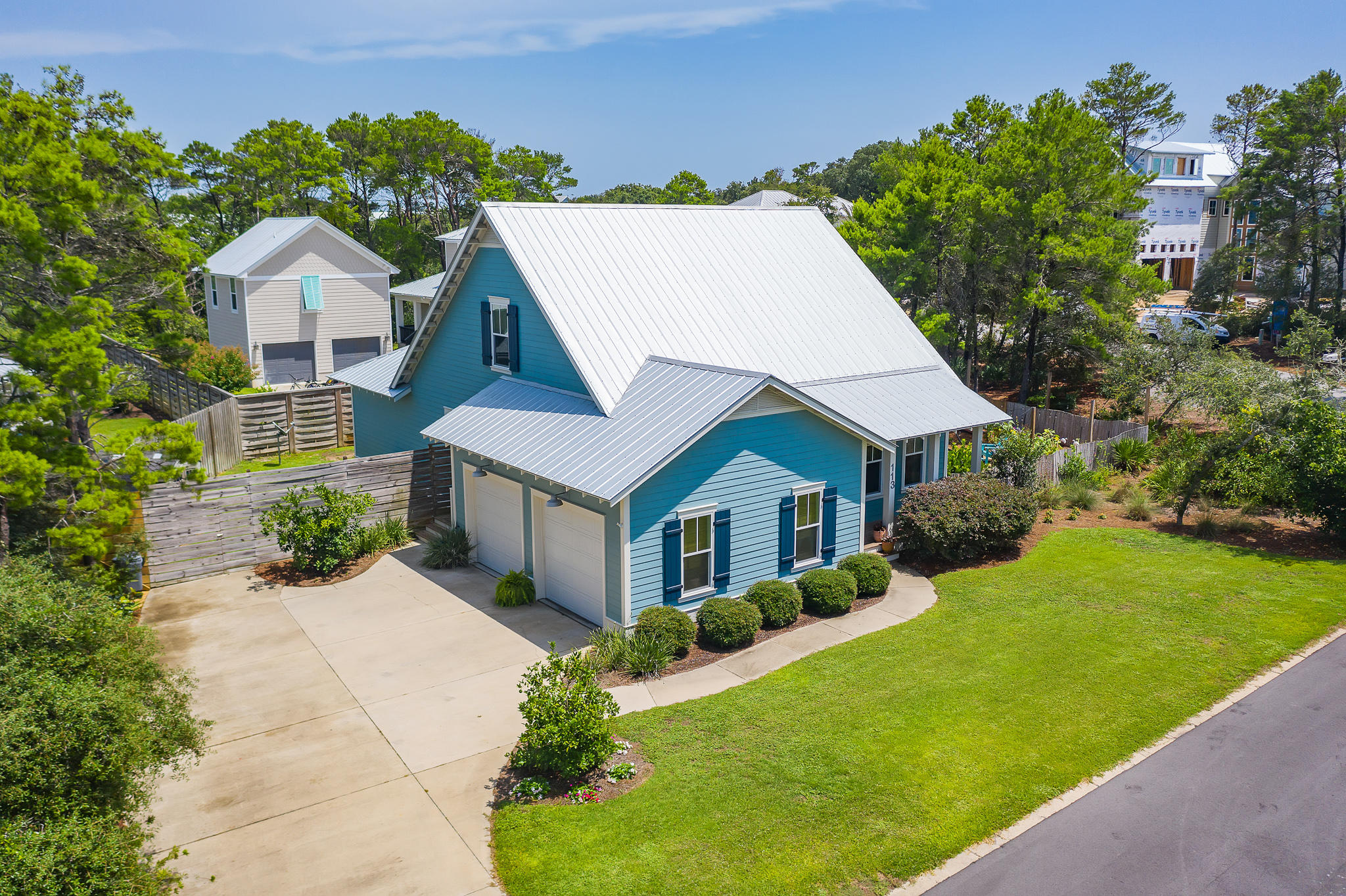 Located in Old Seagrove just two blocks from the gulf  on a large corner lot and less than 1/2 mile to Seaside.  The open floor plan features antique oak floors throughout and is anchored by a floor-to-ceiling brick fireplace. Two sets of french doors open on to the screened in porch allowing for indoor/outdoor living. The well appointed kitchen features hand-hewn shelving, farmhouse sink, glass cabinets, stainless appliances & quartz countertops. The master bedroom on the main floor offers the convenience of one floor living. A guest bedroom & full bath are on the main floor. An additional guest bedroom and a large bonus room along with full bathroom are located on 2nd floor.  Plenty of room to add a pool. Never rented