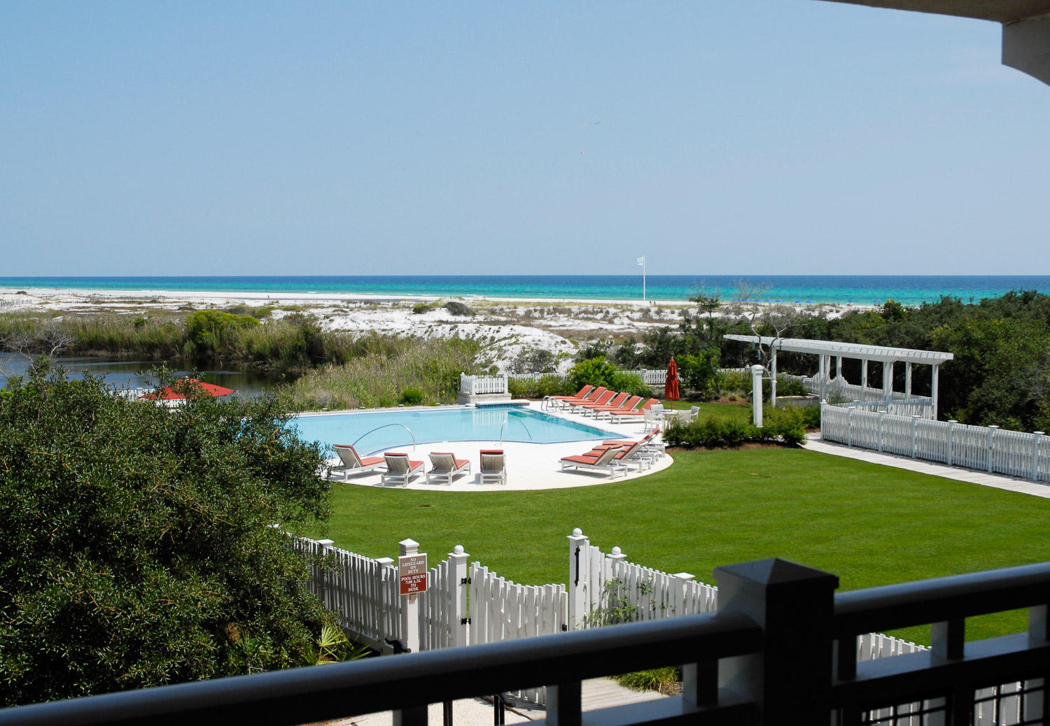 Just steps to the Beach, this 3-bedroom, 3.5 bathroom townhouse style condo features gulf, lake and pool views!  Inside you will find gorgeous hardwood floors in the kitchen, dining and living areas. Gourmet kitchen, with granite countertops, stainless steel appliances, and a Viking gas range. Master bedroom is located on the first floor with private bathroom with a shower and a spa tub, and a private screened porch. Two guest rooms are located on the second floor both with ensuites. The second-floor balcony offers outstanding views and a great place to relax and enjoy.  You will find plenty of room for storage in the attached garage!  Enjoy the private and beautiful community pool nearby or take a quick walk over to the beach and enjoy the GULF. Close to all that 30A has to offer....the best local dining, shopping, and entertainment in Watersound, Watercolor, Rosemary Beach, and The Hub on 30A.