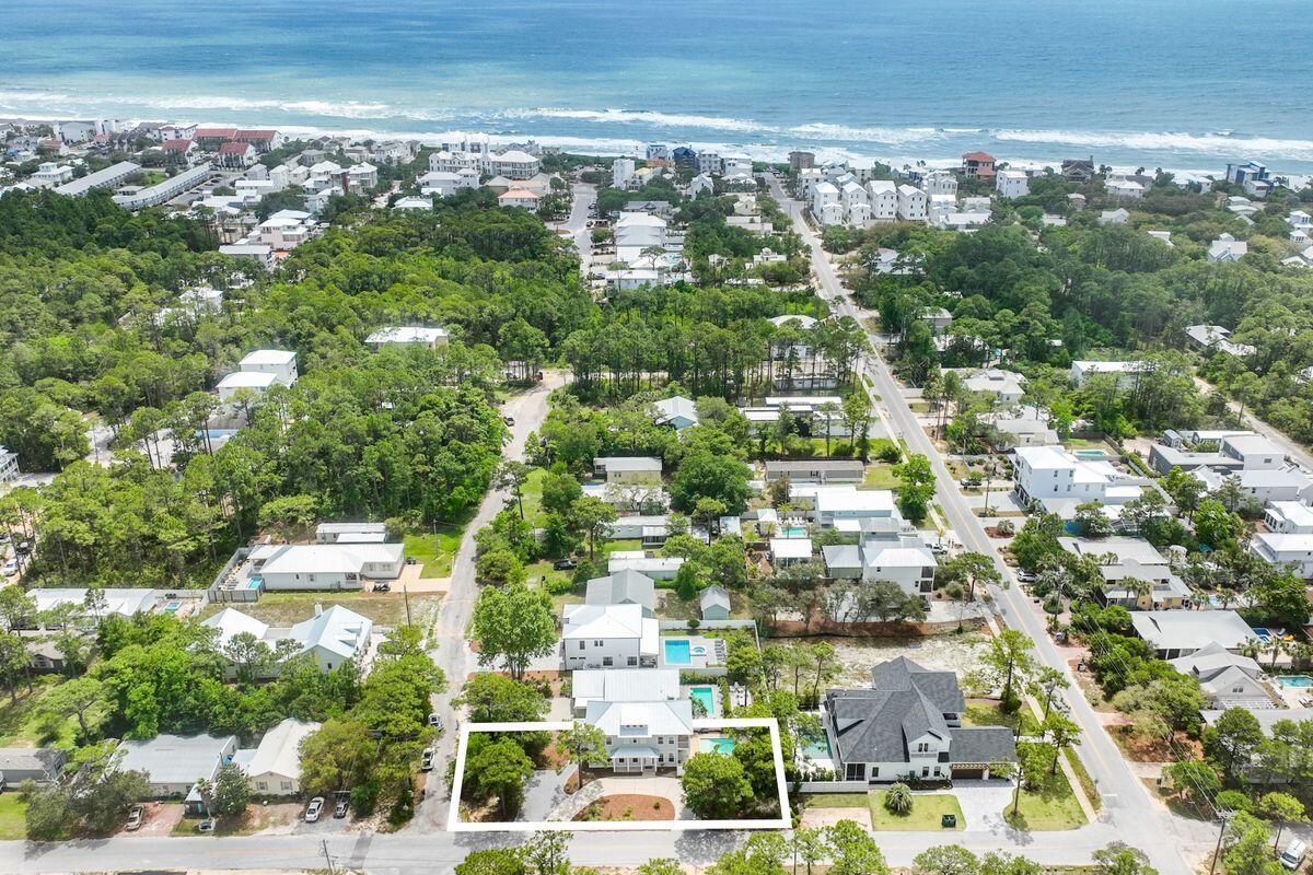 Fantastic investment opportunity or primary home with NO HOMEOWNERS ASSOCIATION! Located in Gulf Shore Manor in the heart of Seagrove Beach and about 2 miles from Seaside! Walk or golf cart to SEVERAL DEDICATED BEACH ACCESSES (the closest one two blocks away on San Juan Avenue) 30A shops, upscale boutiques, restaurants and nightlife! This turnkey vacation rental was built in 2015, is 2250 square feet, has never allowed pets inside, and has nine years of excellent rental history with great reviews on VRBO.com! All current bookings will convey to new buyer if they stay with current rental company. Private heated pool with large pool deck is ideal for entertaining! The circular driveway can accommodate parking for 7 cars, and even an RV! This corner lot has room to add a 2-car garage and carriage home. For more added convenience, there is a golf cart garage for your golf cart and beach toys! This wonderful property comes fully furnished with an open floor plan. The kitchen has newer stainless appliances, granite countertops and a large pantry make it easy to cater for larger parties. The generous L-shaped island accommodates extra diners for breakfast while making plans for the day's activities. The primary suite is on this level with a beautiful bathroom featuring a stand-alone tub and separate shower. A laundry and powder room complete the first-floor accommodations. Stairs lead up to a spacious loft area, furnished with a sofa and trundle bed. This flexible space is suitable for watching TV or using as a game room/den. Doors open onto a covered porch overlooking the brick paved pool deck. Three further bedrooms include a second spacious master bedroom with en-suite bathroom, a bunk room, queen room, and double vanity bathroom, and an owner's closet to complete the turnkey accommodations. Recent upgrades to this well-maintained property include a new pool pump, pool lights and pool heater, two new HVACs, a new refrigerator, dishwasher and washer/dryer.