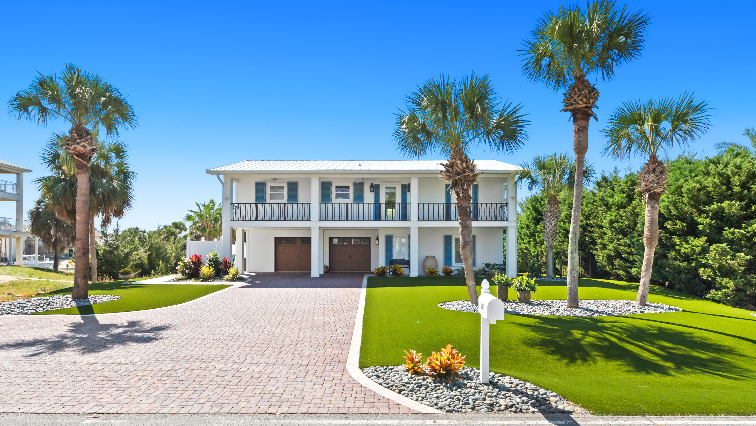 Located in the exclusive and highly sought-after community of Holiday Isle, 620 Lagoon Drive offers the ultimate coastal lifestyle. This beautifully maintained two-story home sits on a serene waterfront lot with immaculate landscaping and an oversized driveway, perfect for guests. The large two-car garage offers ample storage, a work area, and hurricane-resistant garage doors. Inside, the first floor offers a spacious bedroom with an ensuite bath and a walk-in closet. Upstairs, the heart of the home unfolds with an open-concept living, dining, and eat-in kitchen--perfect for gathering and entertaining. The kitchen has been recently renovated with modern finishes and high-end design, while the master bath has been reimagined as a spa-like retreat. Step outside to enjoy sweeping water views from the newly redone upper deck. The backyard has been completely transformed with a new heated pool, all-new upper and lower decking, fresh stonework, fencing, landscaping, and an outdoor grill. Boaters will appreciate the fully redone sea walls and pilons, along with all-new docks and three boat slips (two equipped with lifts) for effortless access to the water. Notable upgrades include new doors and sliders throughout, new exterior lighting, two new tankless water heaters, a whole-house water filtration system, a new roof, and new storm force shutters. Adding to its appeal, the property includes deeded beach access just a short .24-mile walk to the Gulf, making it easy to enjoy sugar-white sand and emerald waters whenever you please.

Holiday Isle is a private three-mile peninsula nestled between the Gulf of Mexico and Destin Harbor, celebrated for its pristine beaches, scenic walking and biking trails, and tranquil neighborhoods. Residents enjoy convenient access to dining, shopping, golf, fishing, and all the entertainment Destin has to offer while still living in a quiet, resort-style community.

Whether you're seeking a primary residence, second home, or investment property, 620 Lagoon is a rare opportunity to experience the best of Destin living. Schedule your private showing today and discover why Holiday Isle is one of Destin's most treasured communities.