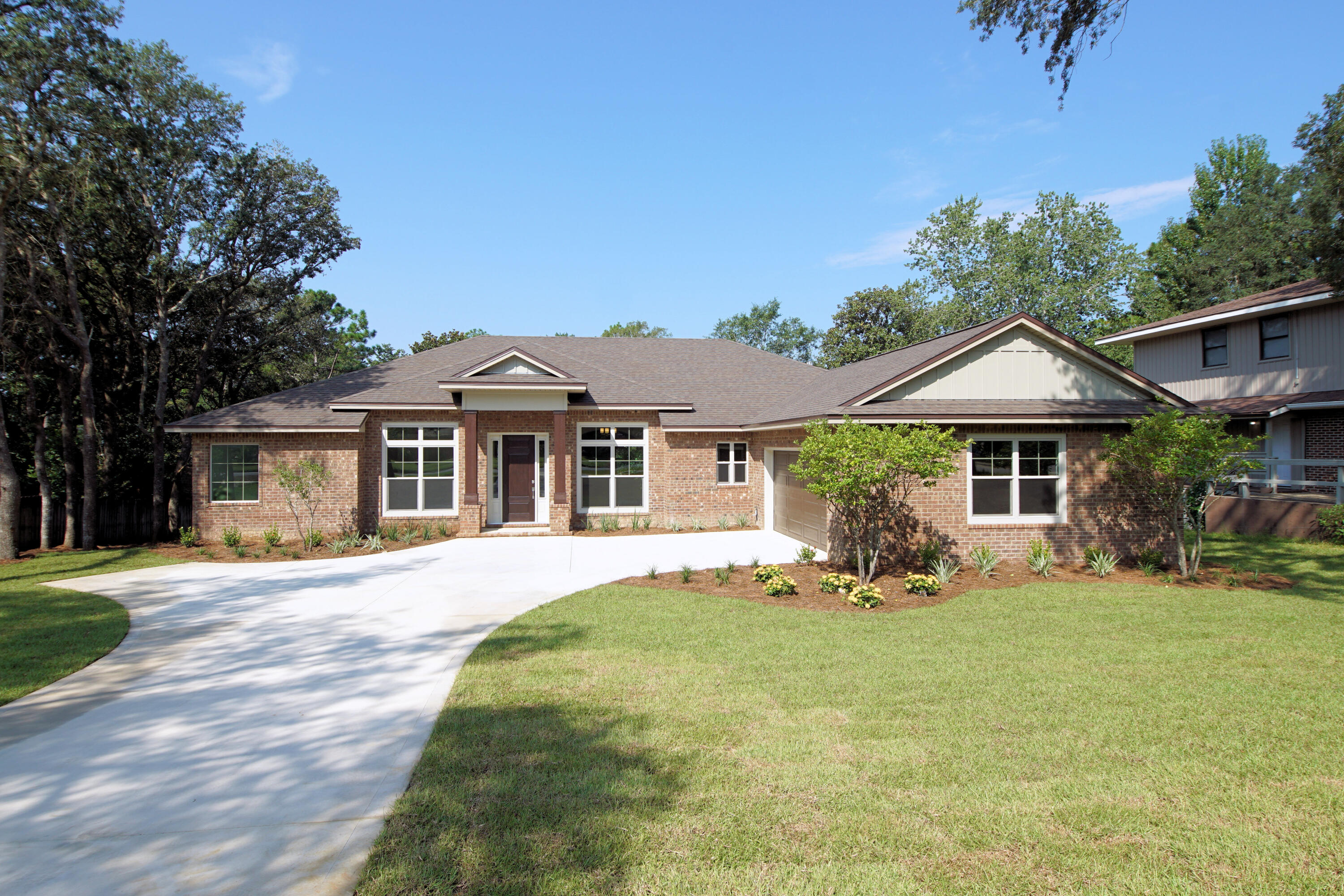 Beautiful new lake front home located in the heart of Niceville!!  This custom home is designed and built by Gary Miller Homes Inc.  (A family business with 40+ years experience in custom residential home design and building).  The floor plan is open with kitchen, living room, dining room and a breakfast area, an office,4 bedrooms and 3 bathrooms. The kitchen has lots of cabinets, granite counters, stainless appliances and an oversized breakfast bar .In the master suite there is a custom shower, stand alone bath tub and shaker style double vanities and two walk in closets. The additional bedrooms are split with two sharing a jack and jill bathroom and the fourth bedroom is at the back of the home with the third bathroom. There is a large laundry room and built in mud room area. The rear covered porch includes gas piping for future BBQ grill and an oversized adjoining composite deck overlooking lake!! All this and a large yard with sprinkler system , sod  and landscaping.