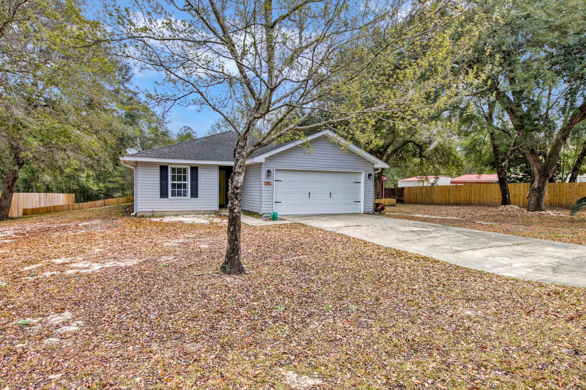 Beautiful ranch-styled home situated on 0.38 acres offers a perfect living space for all. This property is highlighted by a spacious screened in back porch, big living space, and newly built 31x22  functional shop/detached garage that can suit multiple needs. Located near the west entrance of Hammock Bay and short car ride to the beautiful beaches of the Emerald Coast and 30A, this property is a must-see!
