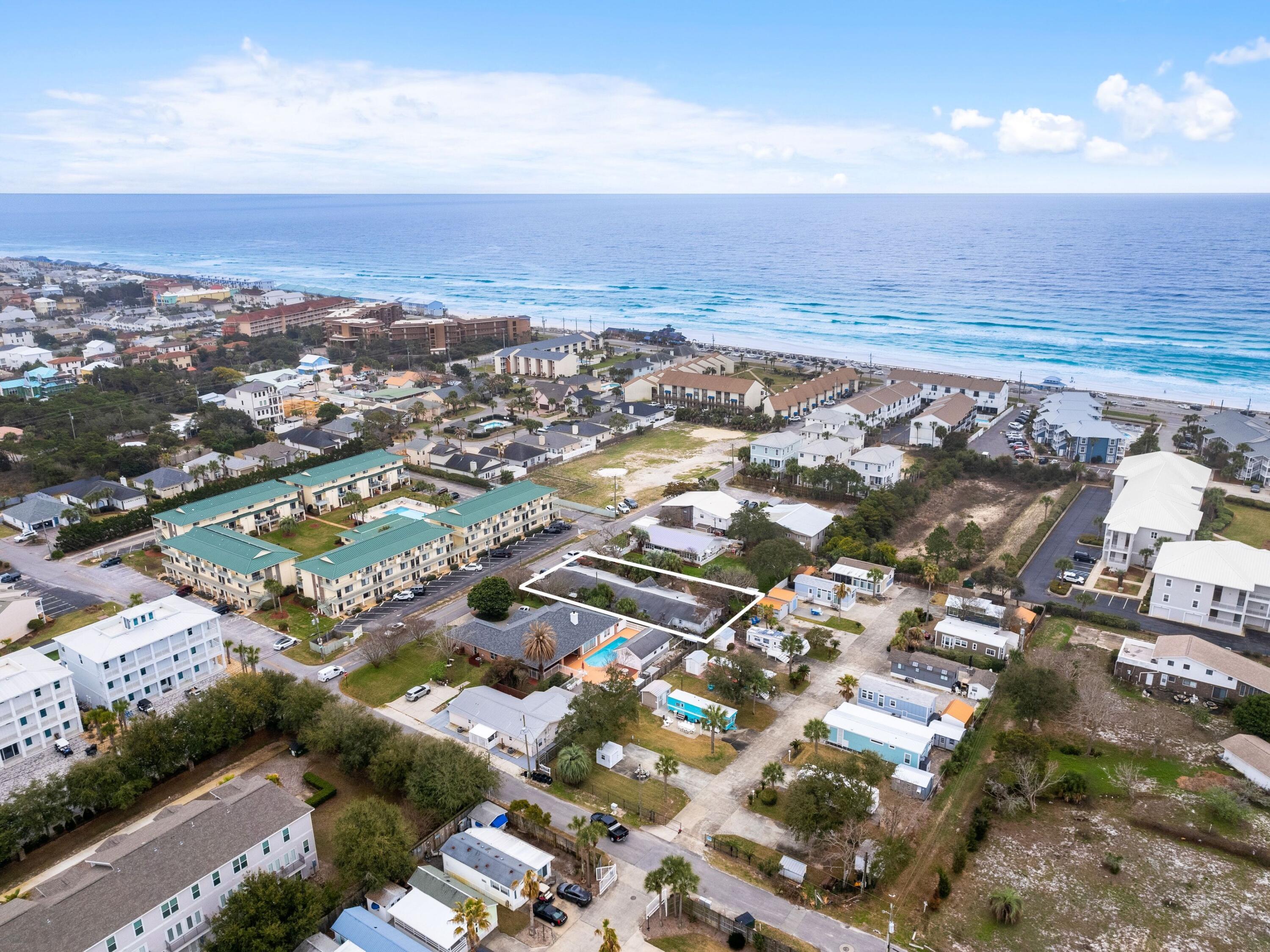 Welcome to a rare opportunity to own the perfect lot in Miramar Beach! This prime piece of real estate is just four minutes away from a beautiful white sandy beach and crystal clear waters, allowing you to enjoy the natural wonders of life every day. This incredible beach lot provides an opportunity to build a truly special home or even a rental property.  The local community has plenty to offer, such as fresh seafood restaurants, local markets filled with goods, public beach access to unwind and take in a sunset.  Currently there are 5 rental units in place (Four 2 bedroom and One 1 bedroom) with tenants on a month to month basis.  May qualify to be granfathered as current use. Don't miss this chance - come see how this lot fits into your plans to build today!