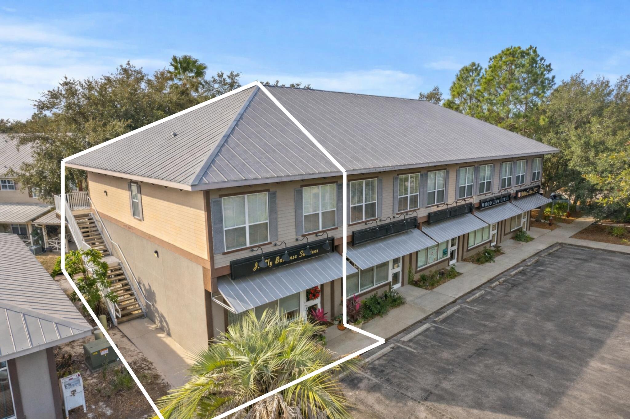 Rare and sought after live/work opportunity in the heart of Destin. Enjoy a first level commercial end-unit currently configured as office space coupled with a one-bedroom residential unit above featuring a full kitchen, living area, and seperate dedicated access.  Located just north of Highway 98 on Airport Road, the location is strategically positioned within close proximity to Destin Executive Airport along with ample retail, dining, and commerce venues. 

The first-floor commercial unit is generously sized encompassing an open flex area, private office, kitchenette, and bathroom creating a blank canvas for a multitude of uses including professional services, legal office, real estate office, and much more. 986 Airport Road is a truly compelling configuration for owner-operators and investors alike- inquire today to learn more.