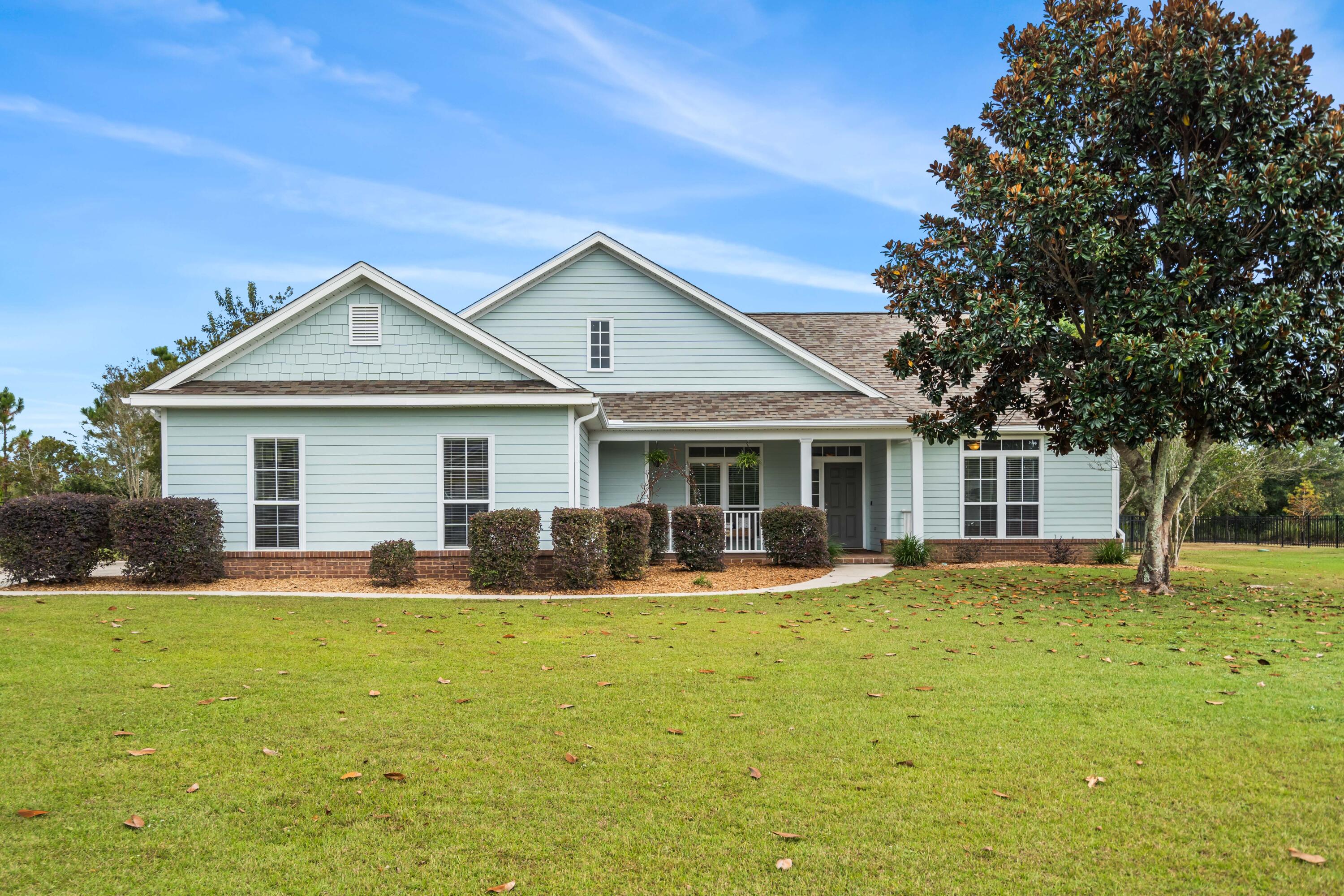 SELLERS ARE OFFERING $5,000 TOWARD CLOSING WITH QUALIFIED OFFER!! Check out this remodeled 4 bedroom, 2 bath home situated on nearly half an acre lot in the gated golf course community of Windswept Estates. This home has the perfect layout to host and entertain with the open-concept living room, dining room, and kitchen. The oversized kitchen features all-new cabinetry with slow-close doors and drawers, up-and-down cabinet lighting, subway tile backsplash, granite countertops, a pot filler, a gas range with a custom vent hood, and a spacious island. Cozy up on the hearth by the gas fireplace in the living room. Luxury Vinyl Plank with an upgraded padded moisture barrier flows consistently throughout the home with tile in the bathrooms. The home has a fresh coat of paint inside and out A new electric water heater was installed earlier this year and the roof was replaced in April 2020. The irrigation system has a new well pump and the 8' tall two-car garage door has new garage springs. The low-maintenance exterior was just painted with Benjamin Moore Regal paint. The fenced, level backyard overlooks tee box #1 of the award-winning Windswept Dunes Golf Course. Windswept Estates offers a community pool, clubhouse, tennis courts, basketball court, and playground.
